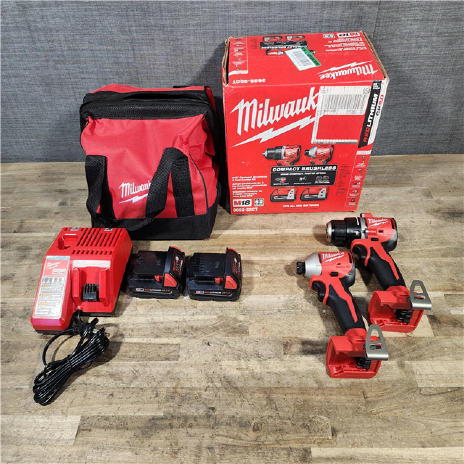 HOUSTON LOCATION - AS-IS Milwaukee M18 18V Lithium-Ion Brushless Cordless Compact Drill/Impact Combo Kit (2-Tool) W/(2) 2.0 Ah Batteries  Charger & Bag