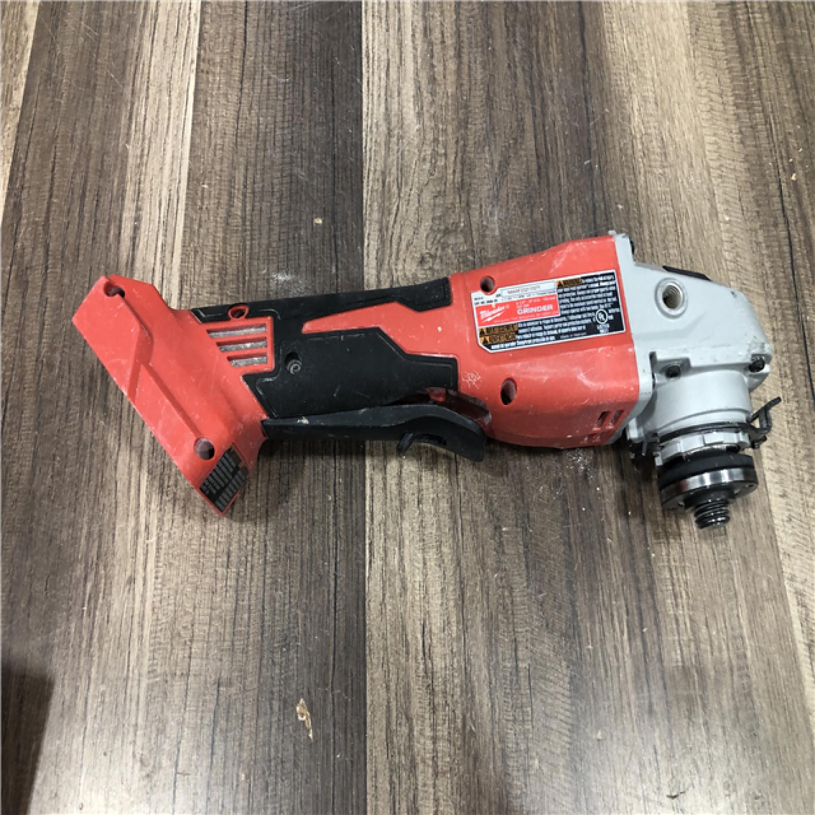 AS-IS Milwaukee 18V Lithium-Ion Brushless Cordless 4-1/2 in./5 in. Grinder w/Paddle Switch (Tool-Only)