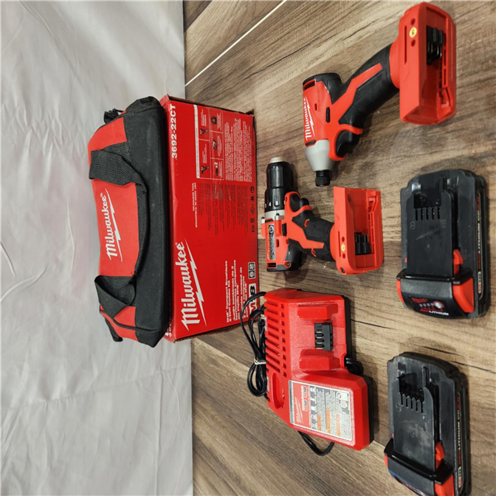 AS-IS Milwaukee M18 18V Lithium-Ion Brushless Cordless Compact Drill/Impact Combo Kit (2-Tool) W/(2) 2.0 Ah Batteries, Charger & Bag