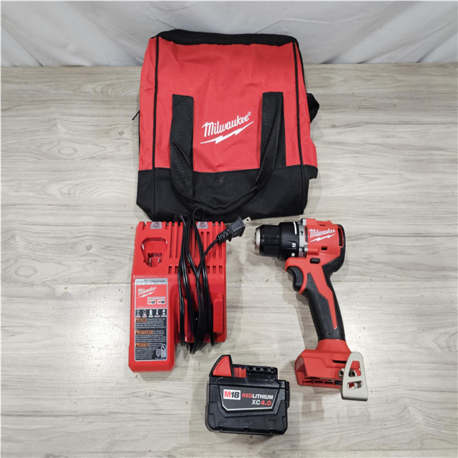 AS-IS Milwaukee 18V Lithium-Ion Brushless Cordless 1/2 in. Compact Hammer Drill/Driver Kit