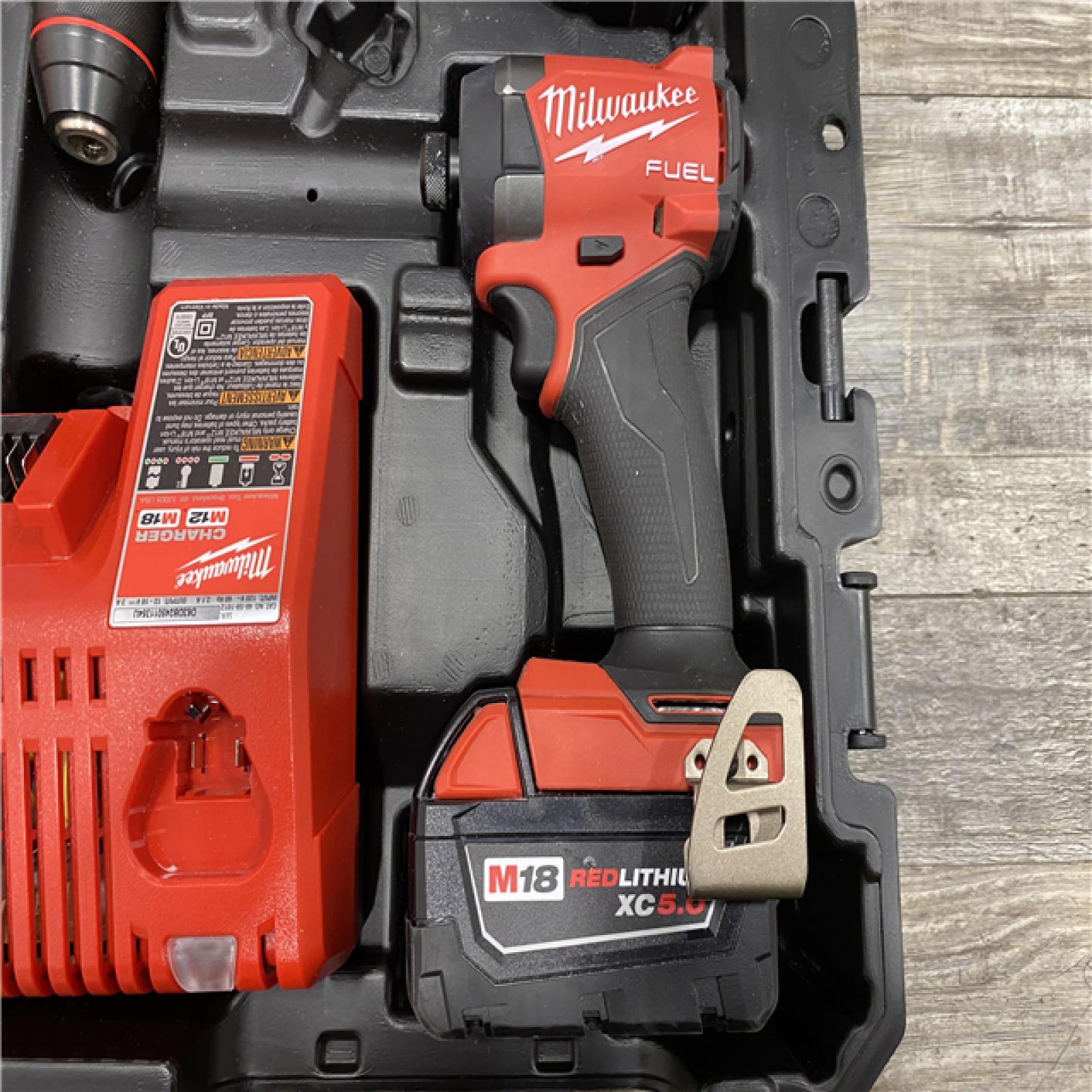 AS-IS Milwaukee FUEL 18V Lithium-Ion Brushless Cordless Hammer Drill and Impact Driver Combo Kit