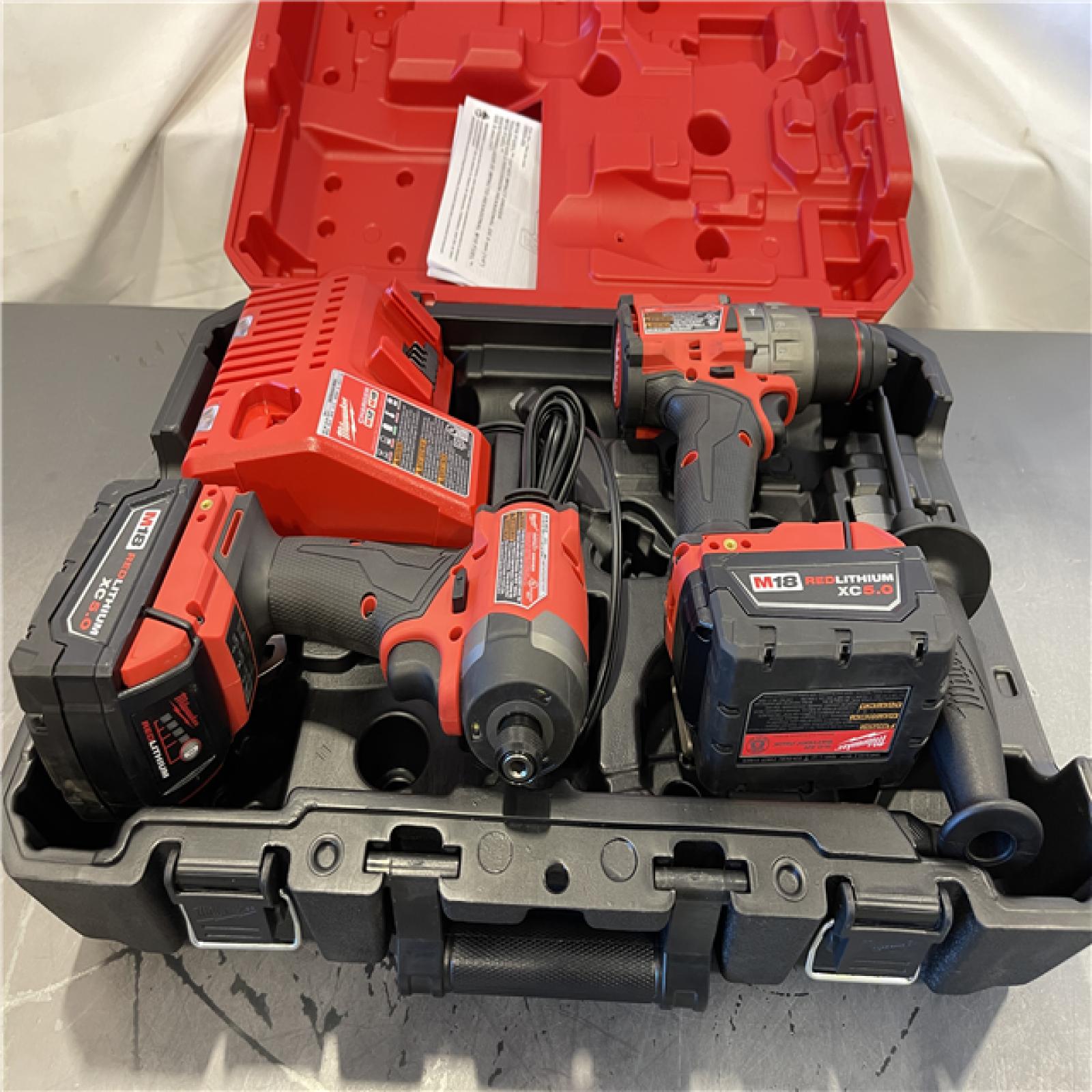 AS-IS - MILWAUKEE FUEL 18V Lithium-Ion Brushless Cordless Hammer Drill and Impact Driver Combo Kit