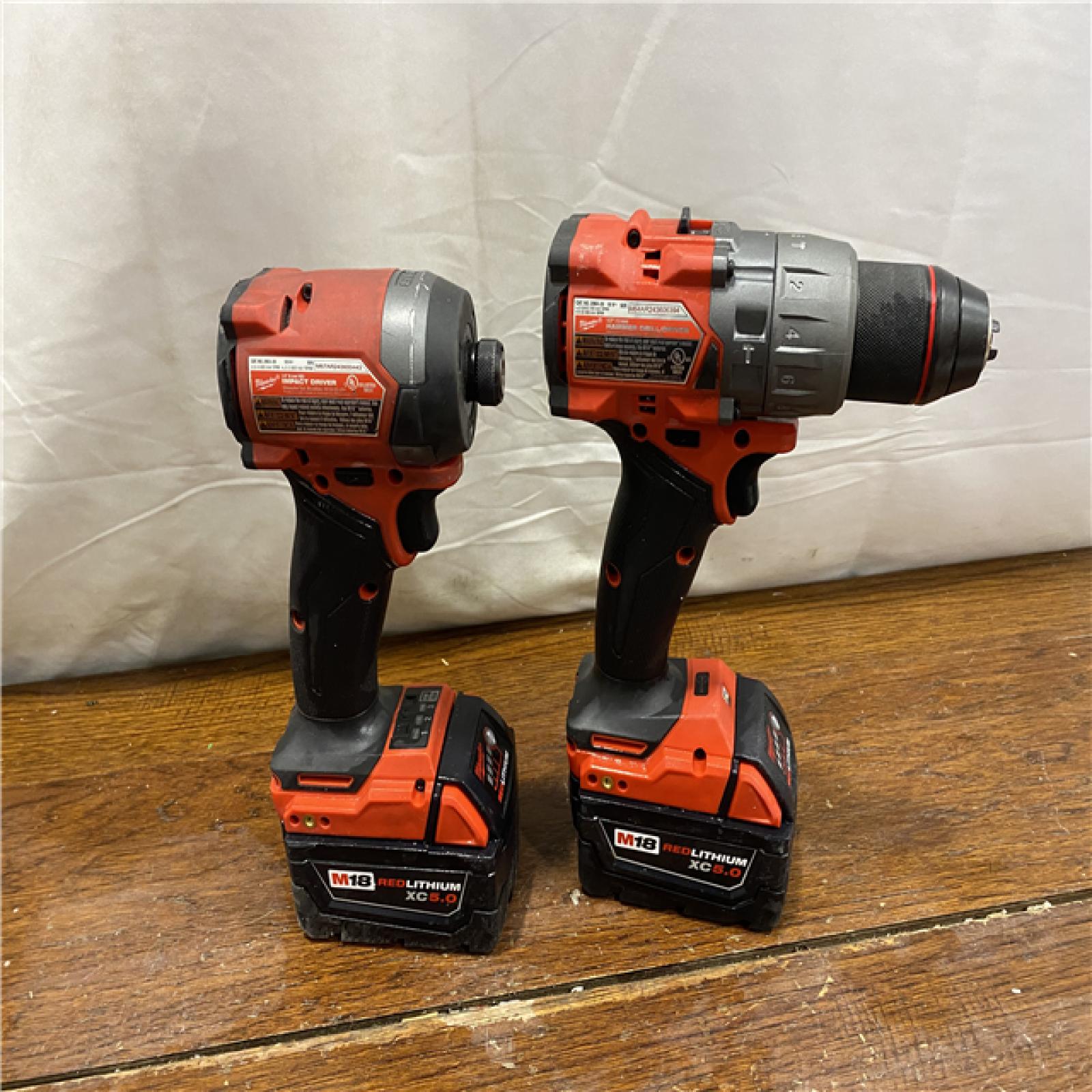 AS-IS MILWAUKEE M18 FUEL 18V Lithium-Ion Brushless Cordless Hammer Drill and Impact Driver Combo Kit (2-Tool) with 2 Batteries