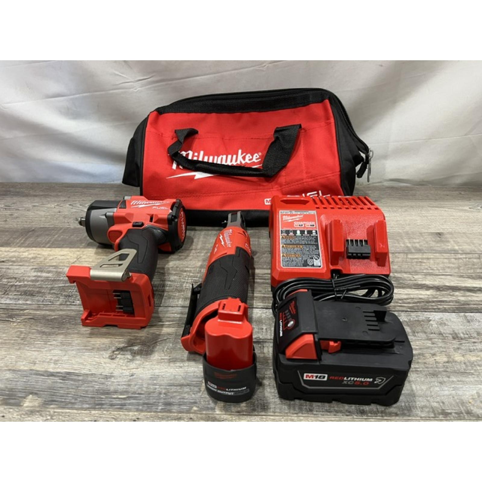 AS-IS Milwaukee FUEL 18V Cordless Mid Torque 1/2 in. Impact Wrench w/ 12 FUEL 3/8 in. Ratchet Combo Kit