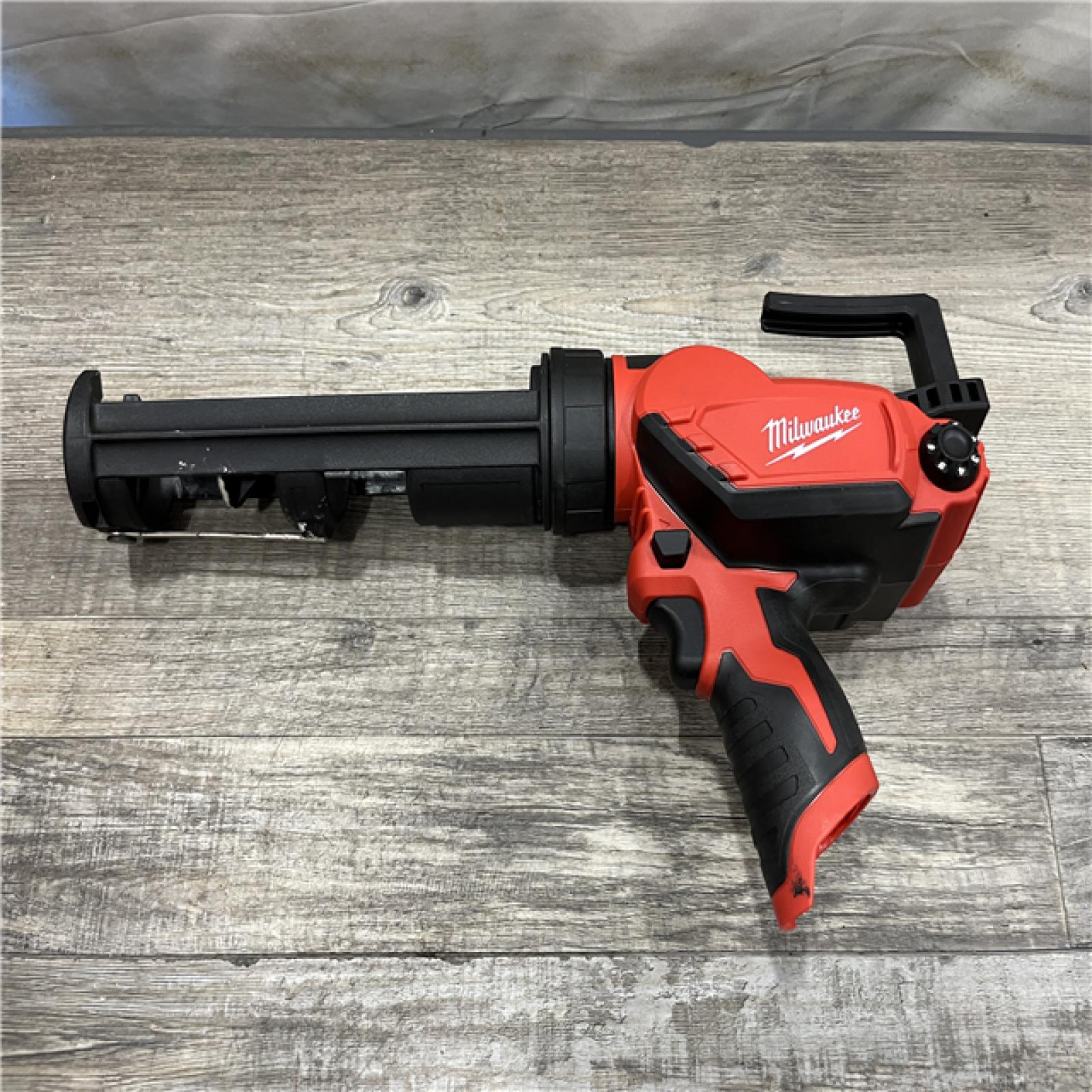 AS-IS Milwaukee 12V Lithium-Ion Cordless 10 oz. Adhesive and Caulk Gun (Tool-Only)