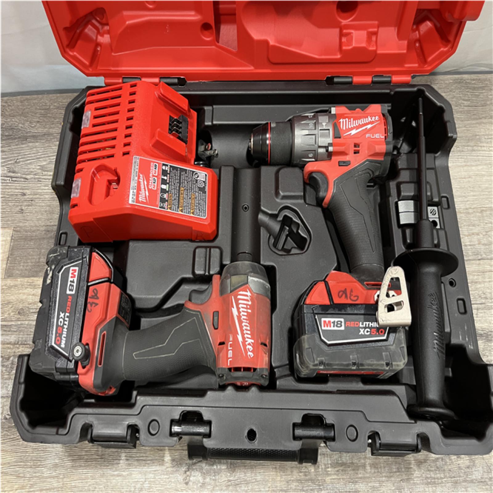 AS-IS Milwaukee FUEL 18V Lithium-Ion Brushless Cordless Hammer Drill and Impact Driver Combo Kit