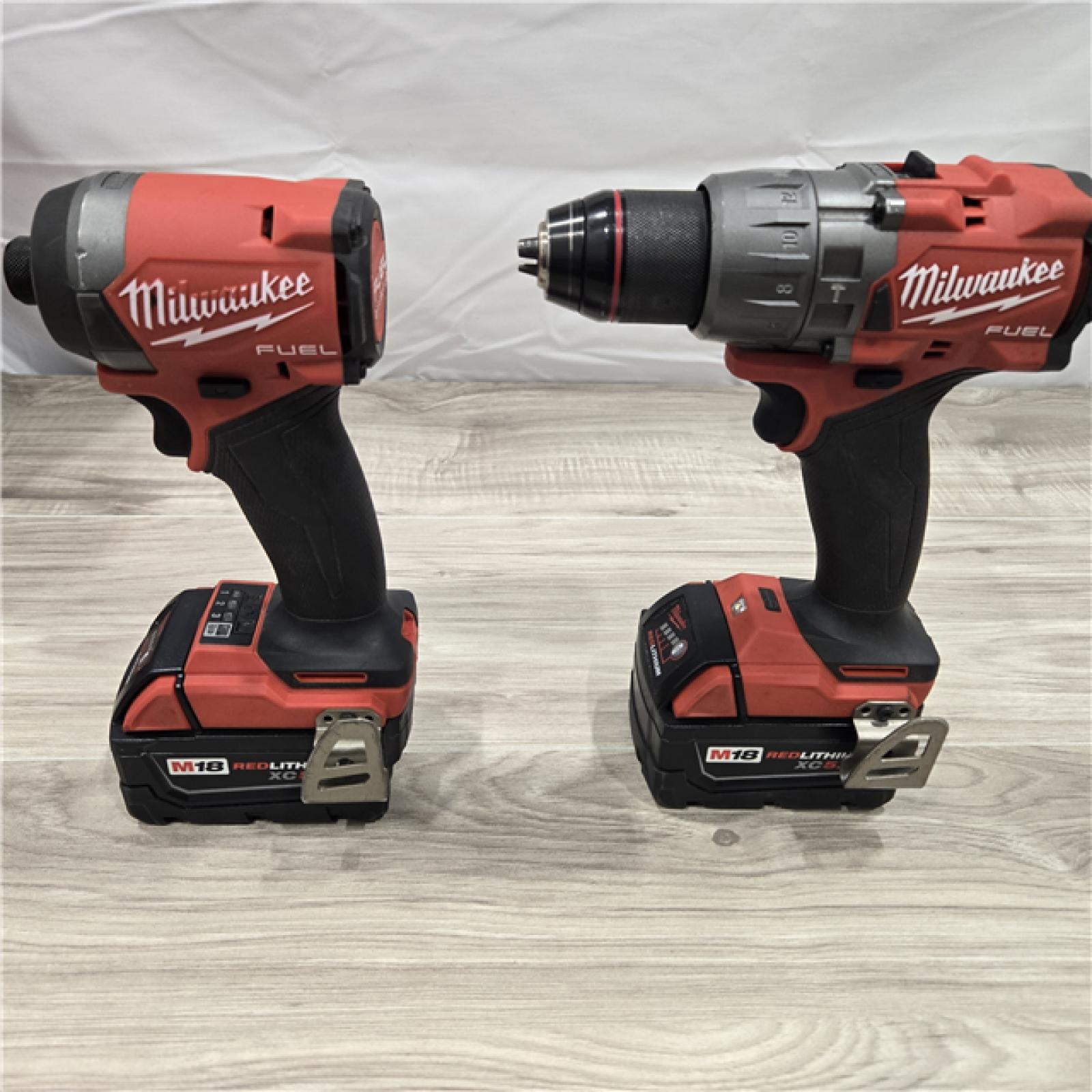 AS-IS MILWAUKEE FUEL 18V Lithium-Ion Brushless Cordless Hammer Drill and Impact Driver Combo Kit (2-Tool) with 2 Batteries