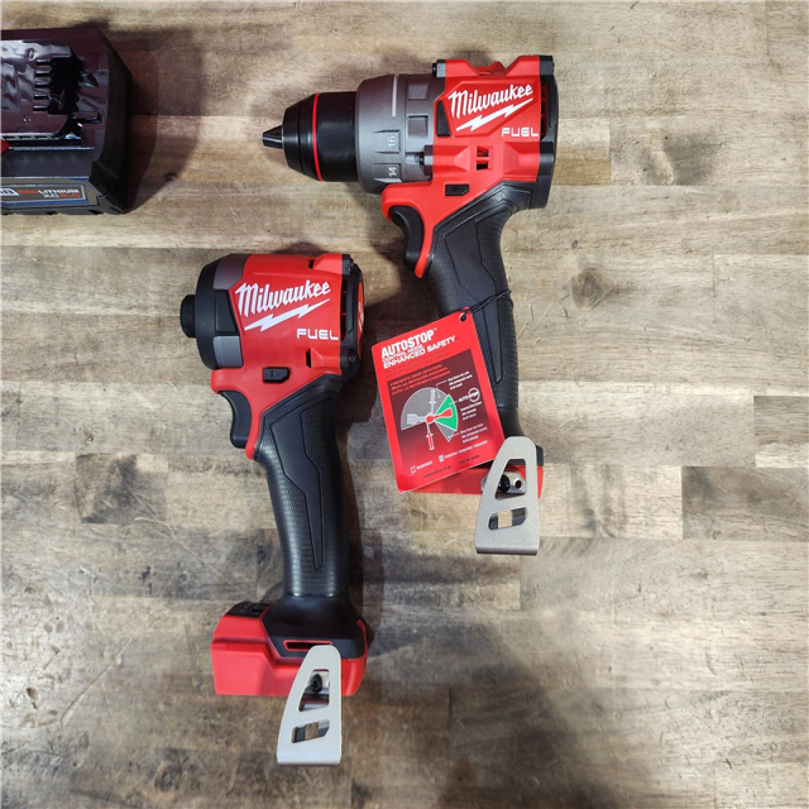 HOUSTON LOCATION - AS-IS (APPEARS LIKE NEW) MILWAUKEE FUEL 18V Lithium-Ion Brushless Cordless Hammer Drill and Impact Driver Combo Kit (2-Tool) with 2 Batteries