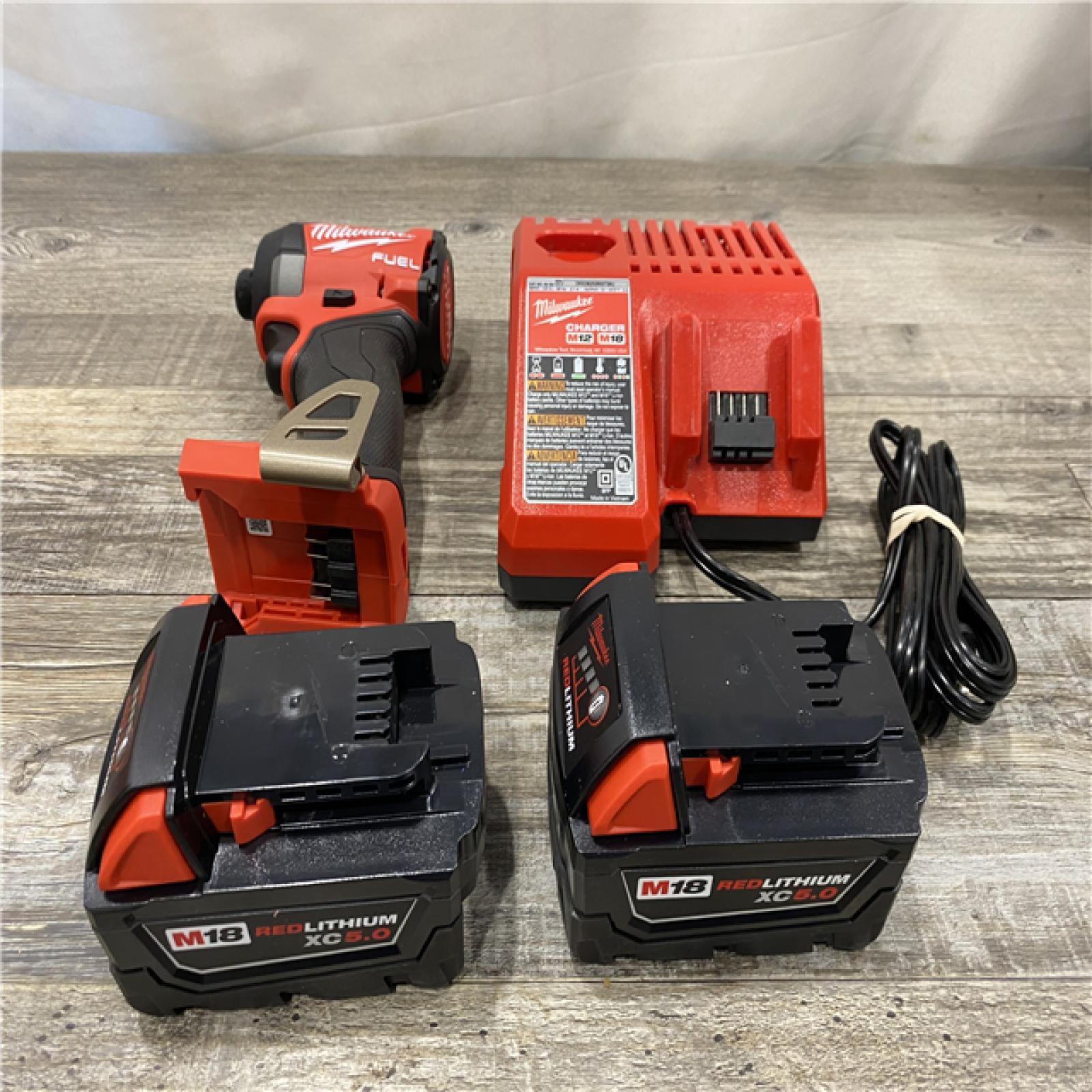 AS-IS Milwaukee FUEL 18V Lithium-Ion Brushless Cordless 1/4 in. Hex Impact Driver Kit