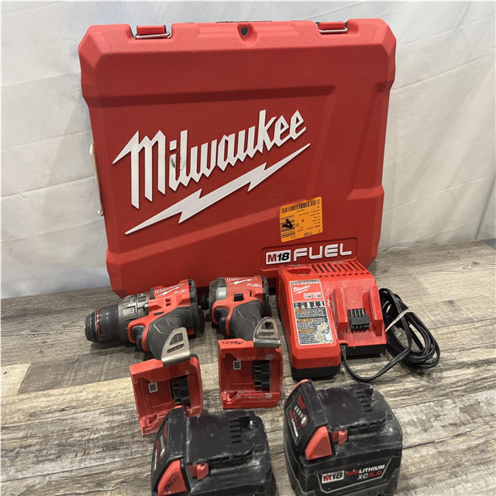 AS-IS Milwaukee FUEL 18V Lithium-Ion Brushless Cordless Hammer Drill and Impact Driver Combo Kit
