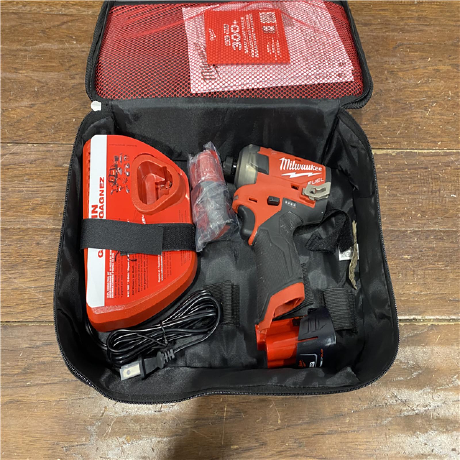 AS-IS M12 FUEL SURGE 12V Lithium-Ion Brushless Cordless 1/4 in. Hex Impact Driver Compact Kit W/Two 2.0Ah Batteries, Bag