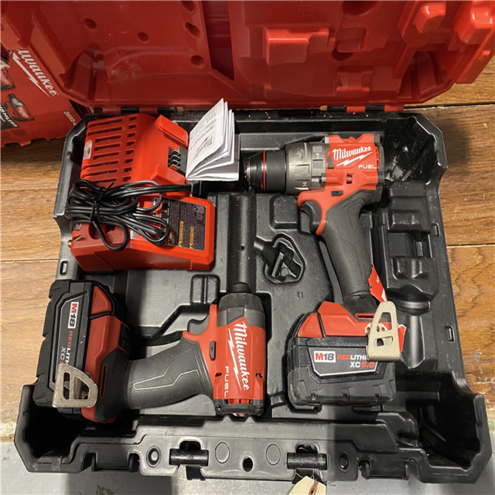 AS-IS MILWAUKEE M18 FUEL 18V Lithium-Ion Brushless Cordless Hammer Drill and Impact Driver Combo Kit (2-Tool) with 2 Batteries