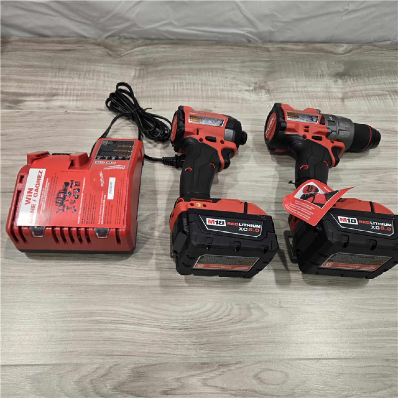 AS-IS MILWAUKEE FUEL 18V Lithium-Ion Brushless Cordless Hammer Drill and Impact Driver Combo Kit (2-Tool) with 2 Batteries
