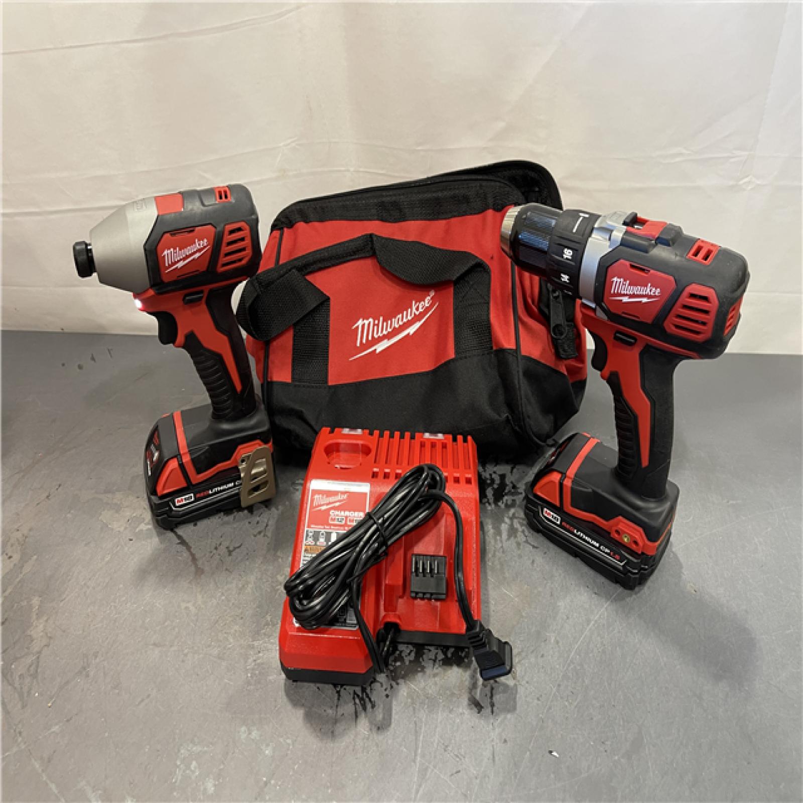 AS-IS - Milwaukee M18 18V Lithium-Ion Cordless Drill Driver/Impact Driver Combo Kit (2-Tool)
