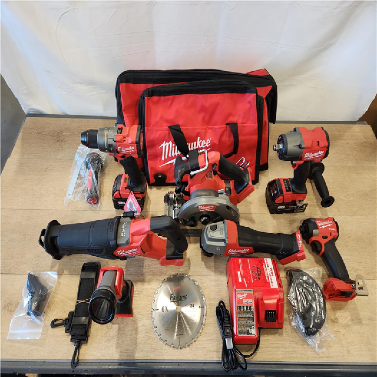 AS-IS- Milwaukee M18 FUEL 18V Lithium-Ion Brushless Cordless Combo Kit with Two 5.0 Ah Batteries  1 Charger  2 Tool Bags (7-Tool)