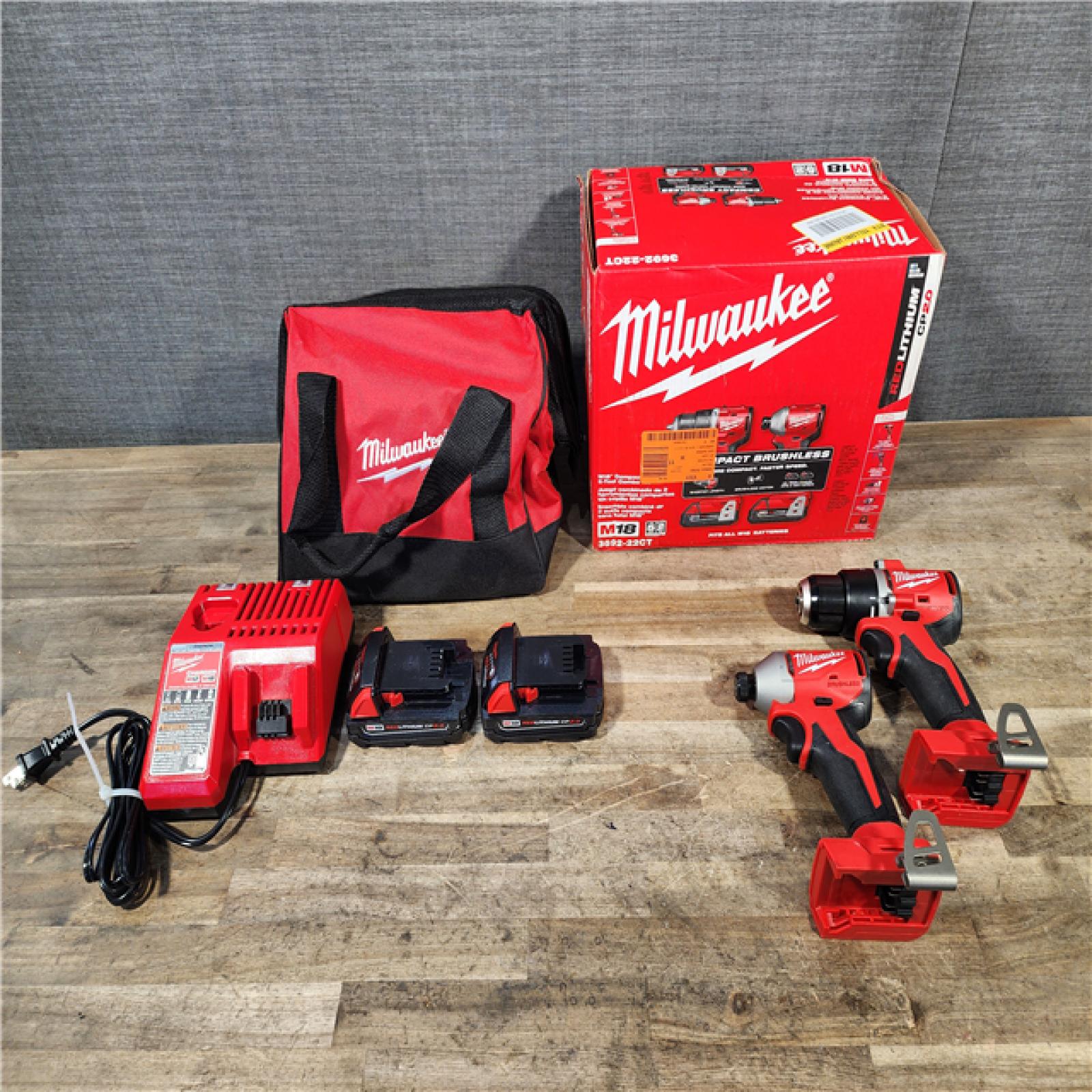 HOUSTON LOCATION - AS-IS Milwaukee M18 18V Lithium-Ion Brushless Cordless Compact Drill/Impact Combo Kit (2-Tool) W/(2) 2.0 Ah Batteries  Charger & Bag