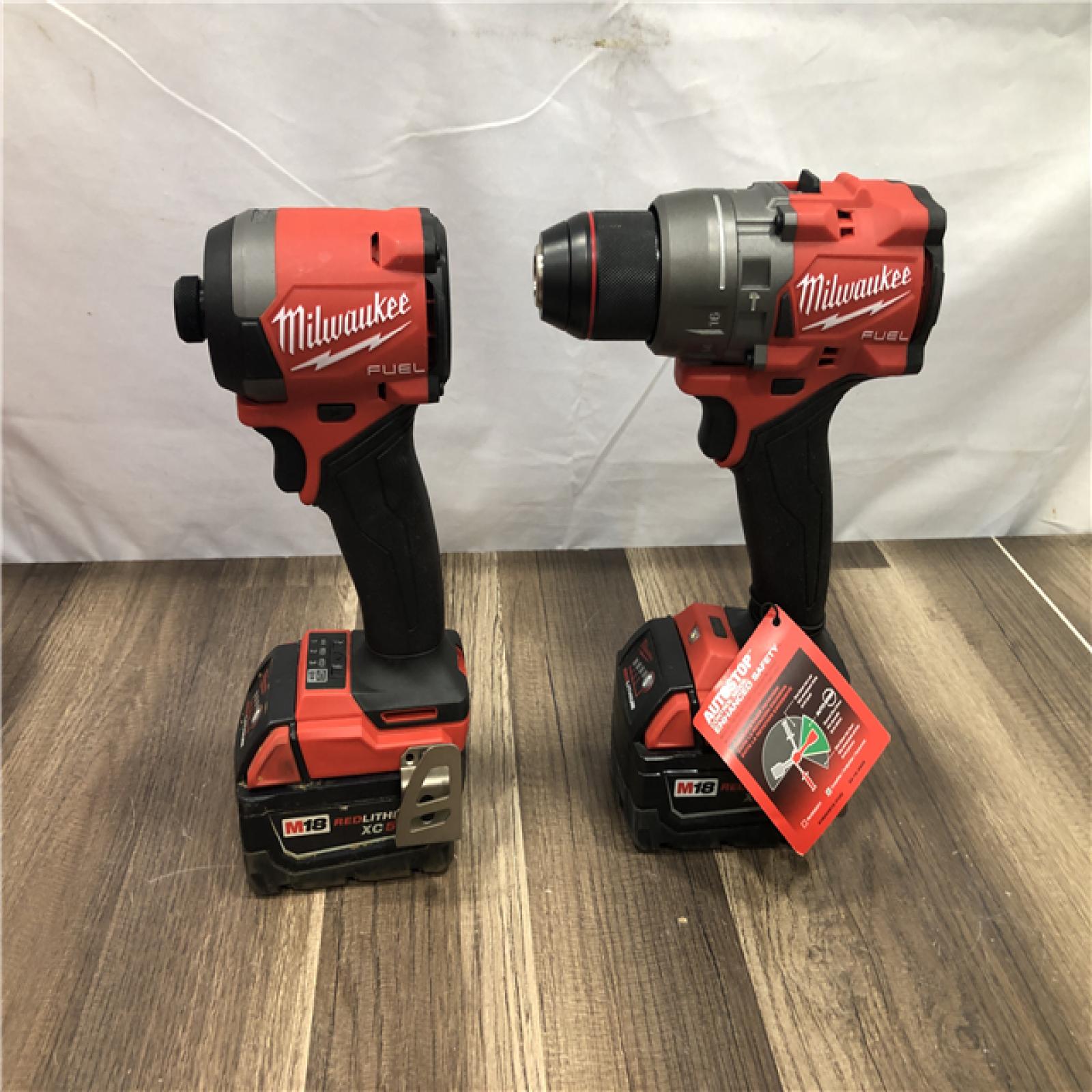 AS-IS Milwaukee FUEL 18V Lithium-Ion Brushless Cordless Hammer Drill and Impact Driver Combo Kit