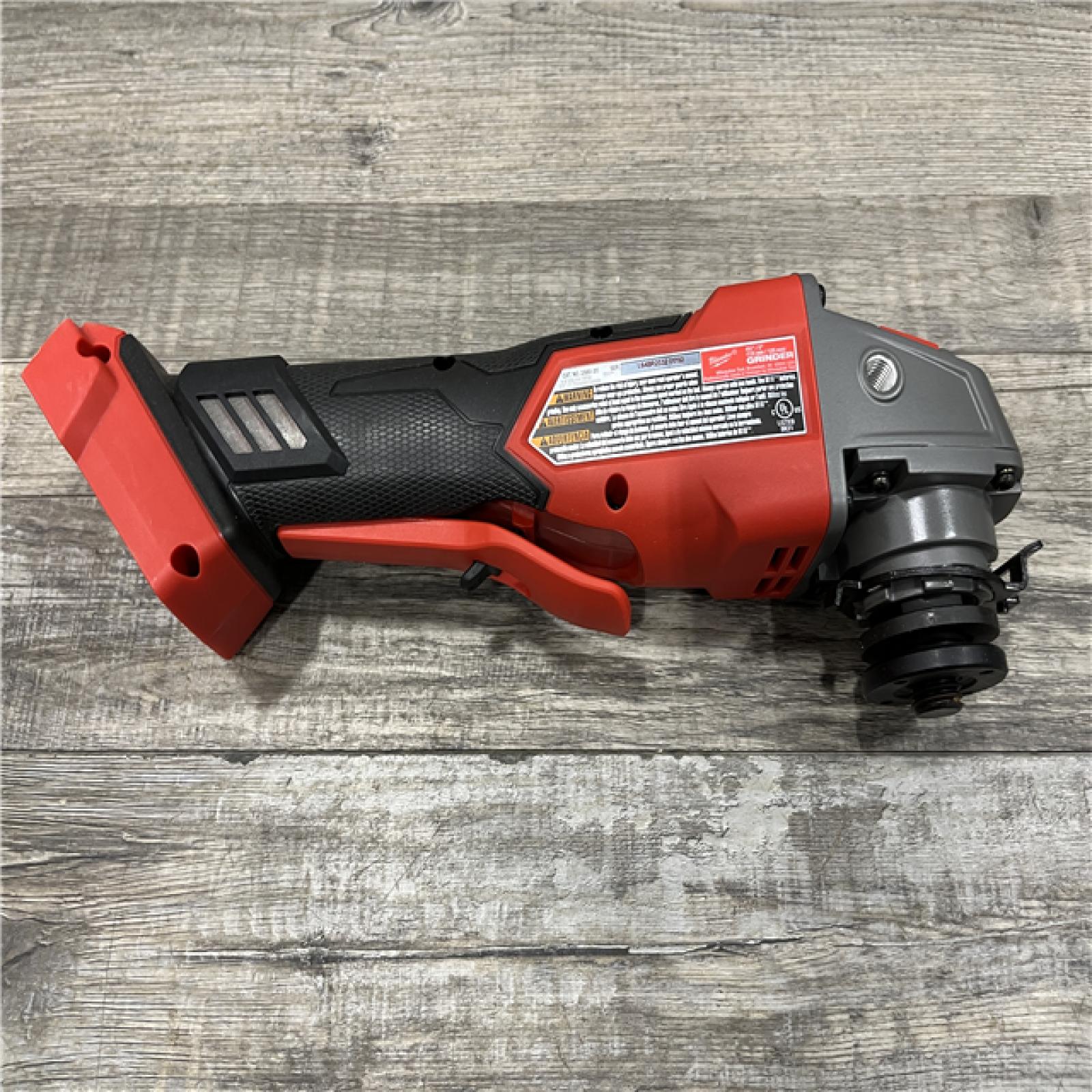 AS-IS Milwaukee FUEL 18V Lithium-Ion Brushless Cordless 4-1/2 in./5 in. Grinder w/Paddle Switch (Tool-Only)