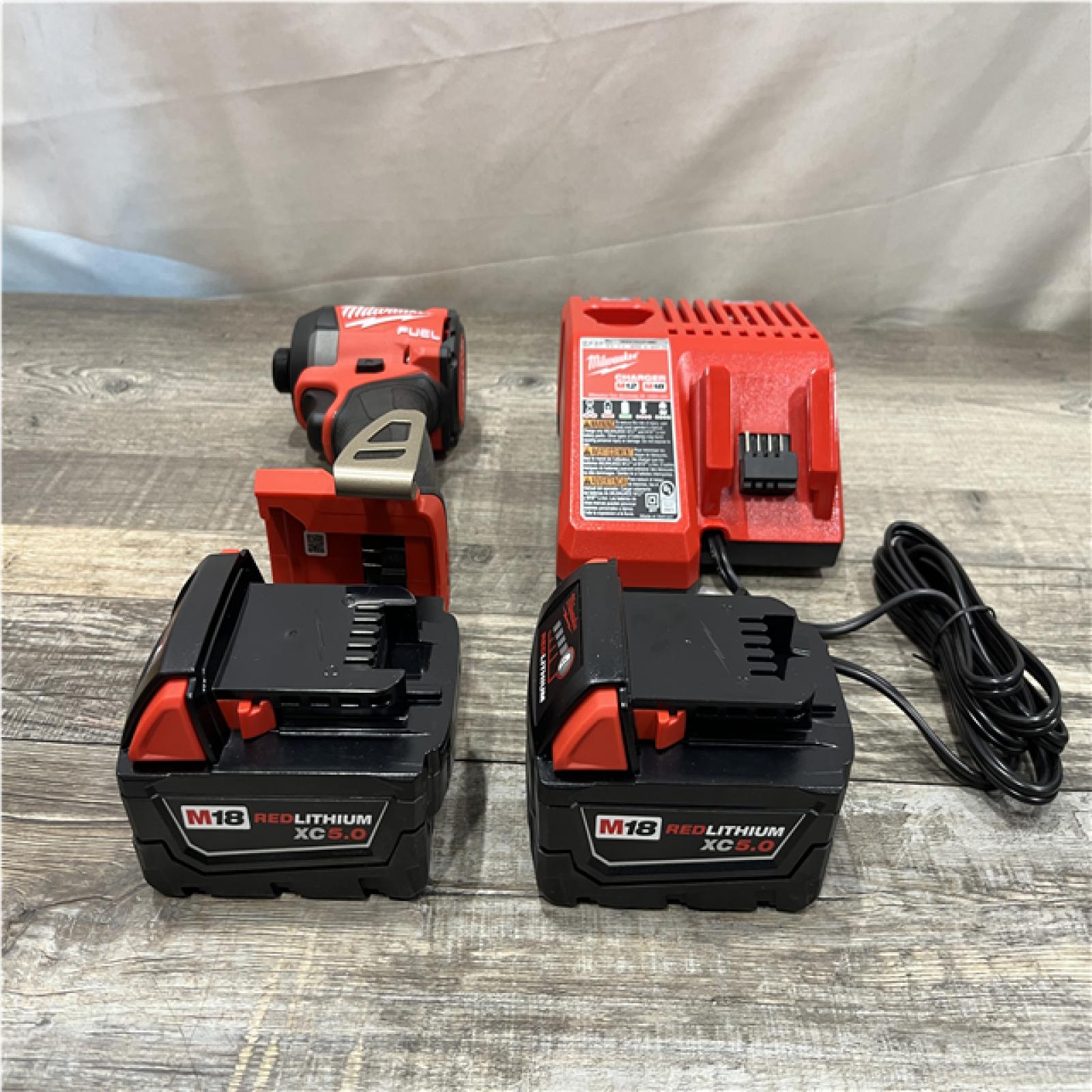 AS-IS Milwaukee FUEL 18V Lithium-Ion Brushless Cordless 1/4 in. Hex Impact Driver Kit