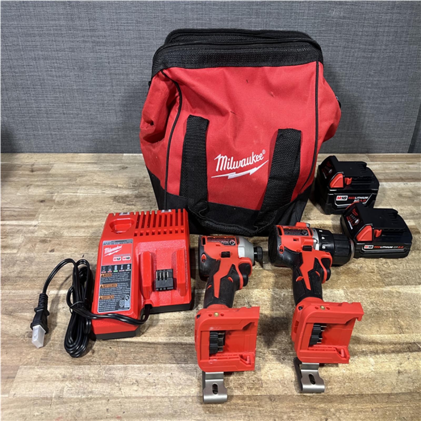 Houston Location AS-IS Milwaukee Hammer Drill Driver and Impact Driver and Batteries QTY/2 with Charger