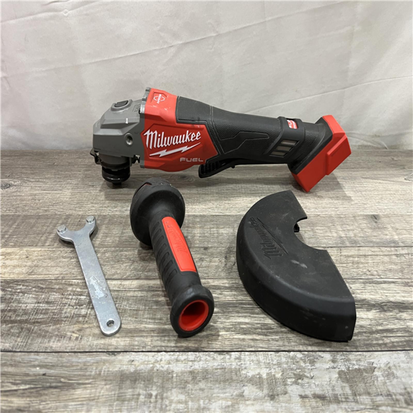 AS-IS Milwaukee FUEL 18-Volt Lithium-Ion Brushless Cordless 4-1/2 in./6 in. Braking Grinder with Paddle Switch (Tool-Only)