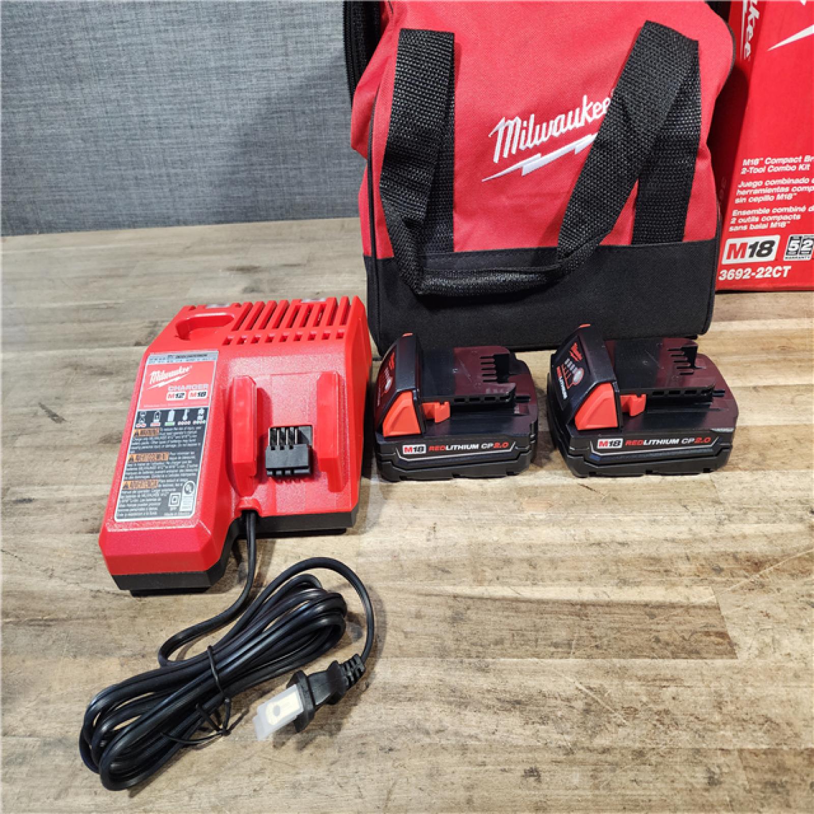 HOUSTON LOCATION - AS-IS Milwaukee M18 18V Lithium-Ion Brushless Cordless Compact Drill/Impact Combo Kit (2-Tool) W/(2) 2.0 Ah Batteries  Charger & Bag