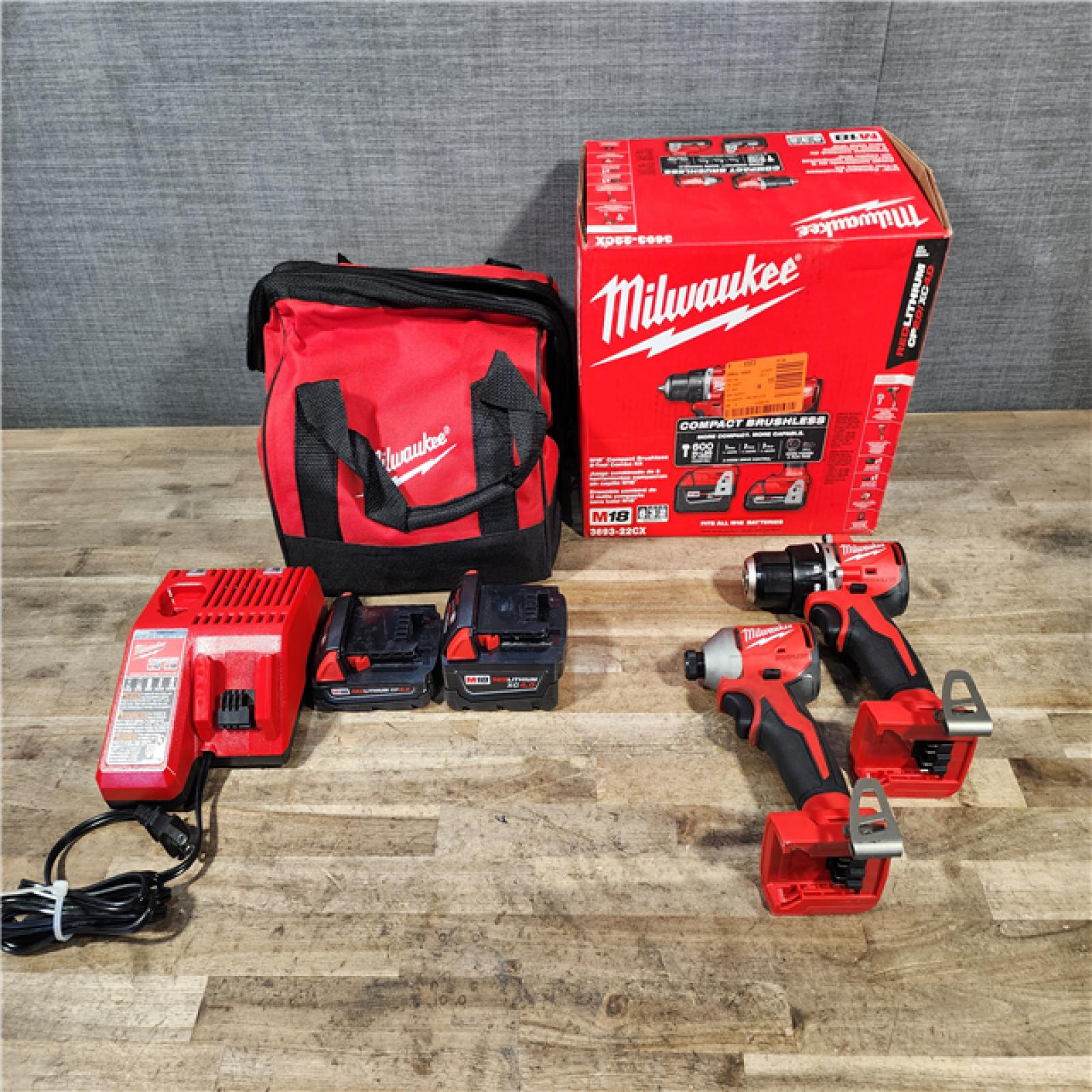 HOUSTON LOCATION - AS-IS M18 18-Volt Lithium-Ion Brushless Cordless Compact Hammer Drill/Impact Combo Kit (2-Tool) with (2) Batteries  Bag