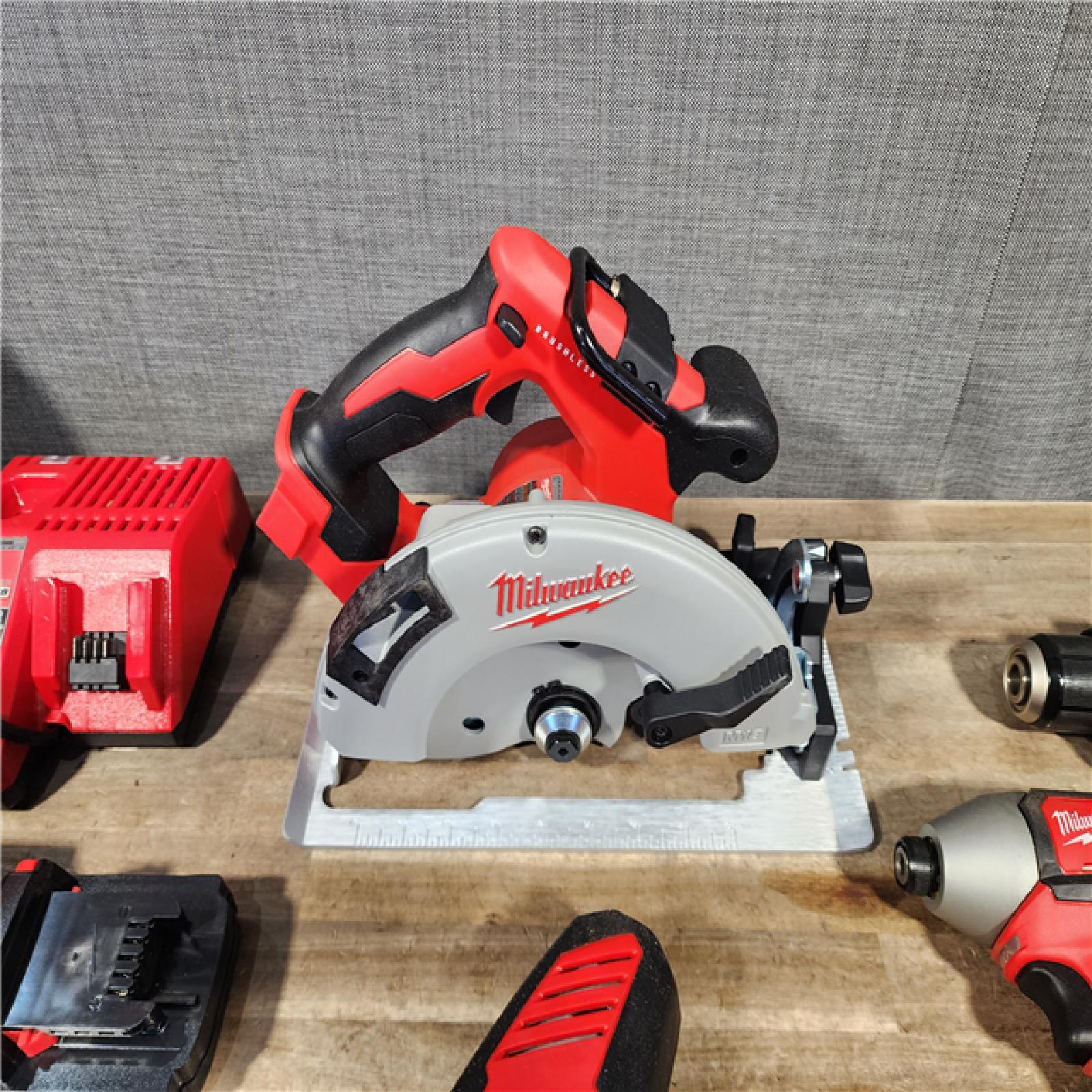 HOUSTON LOCATION - AS-IS Milwaukee M18 18-Volt Lithium-Ion Brushless Cordless Combo Kit (4-Tool) with 2-Batteries  1-Charger and Tool Bag
