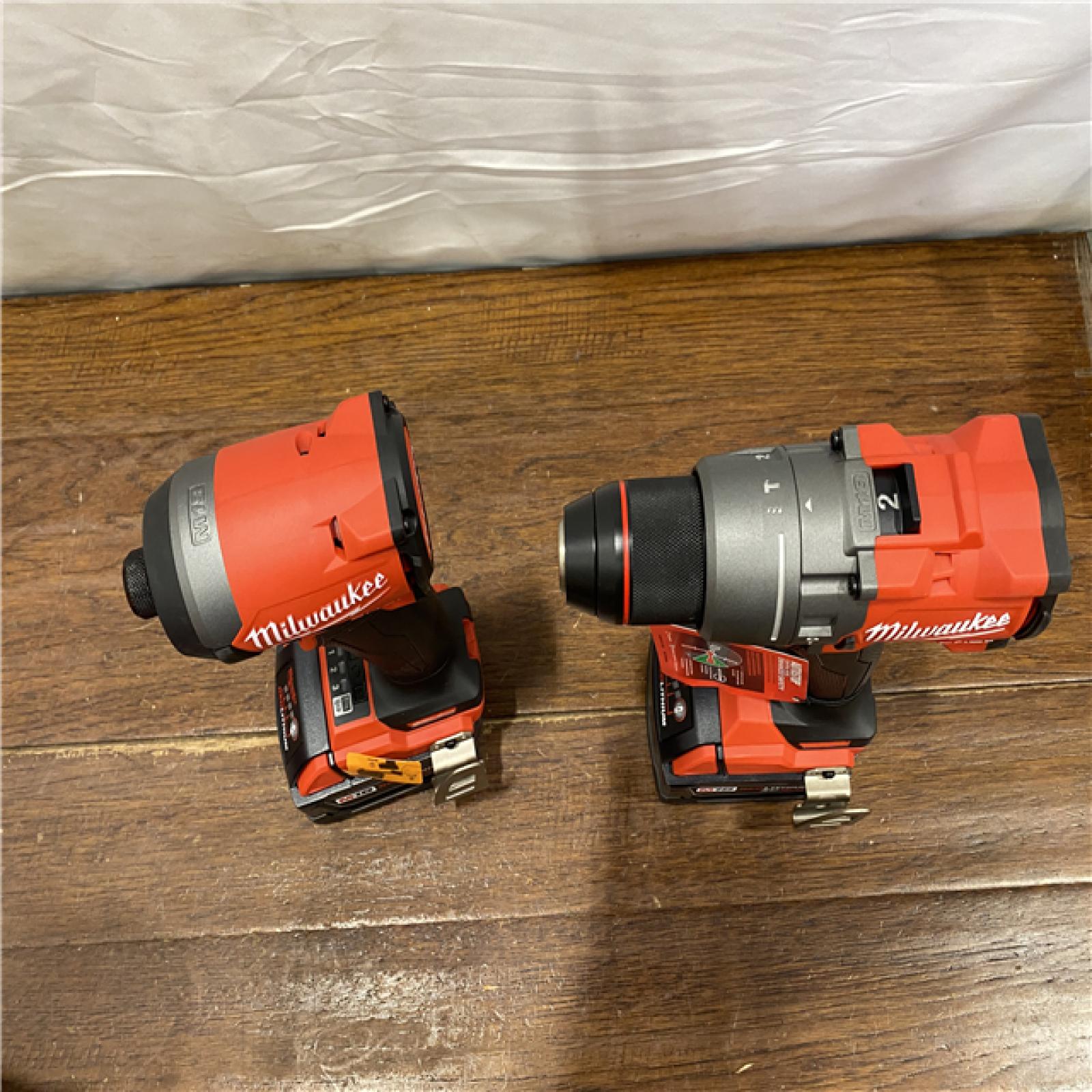 AS-IS MILWAUKEE M18 FUEL 18V Lithium-Ion Brushless Cordless Hammer Drill and Impact Driver Combo Kit (2-Tool) with 2 Batteries