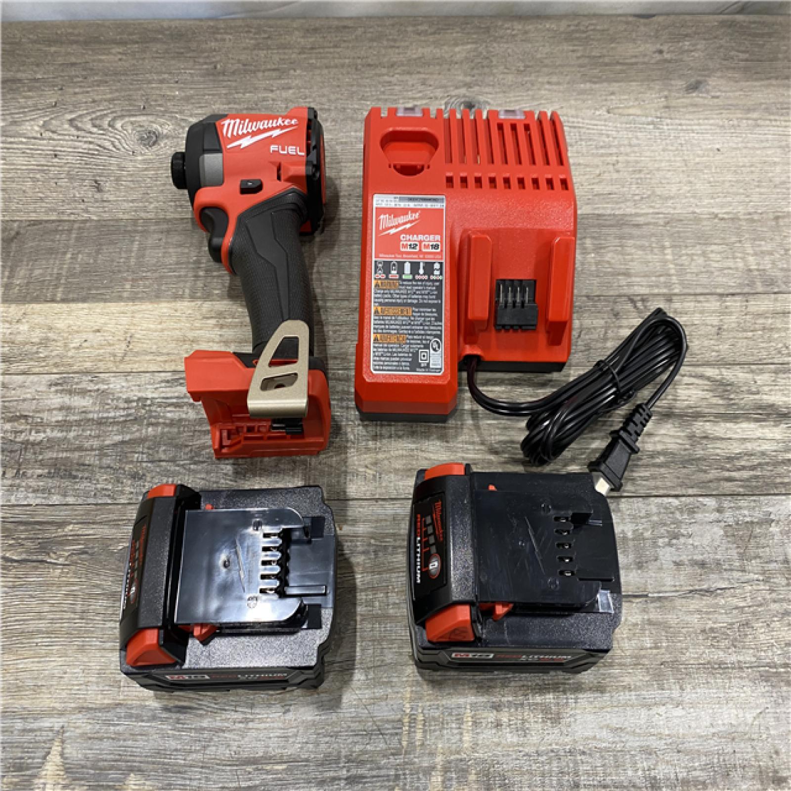 AS-IS Milwaukee FUEL 18V Lithium-Ion Brushless Cordless 1/4 in. Hex Impact Driver Kit