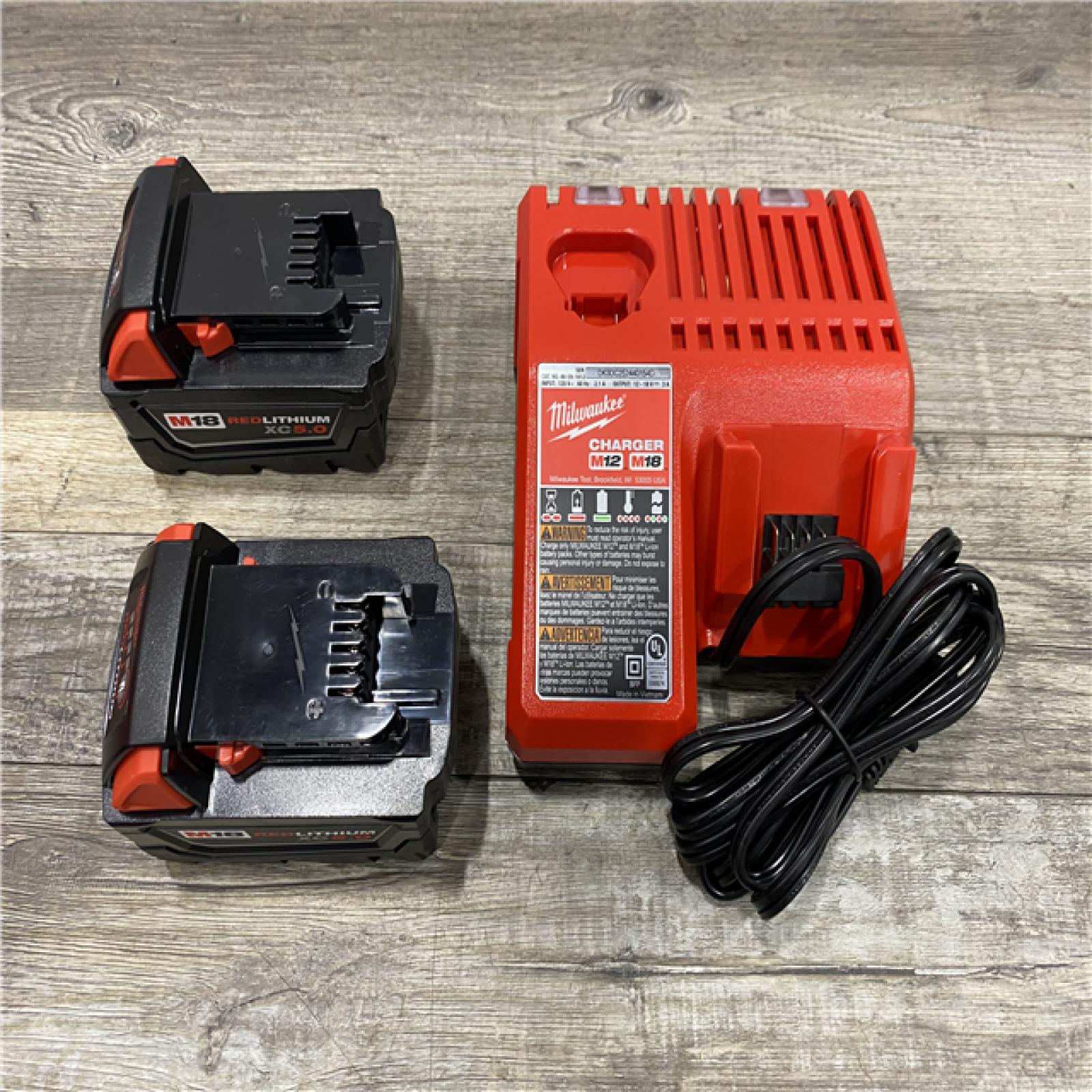 AS-IS Milwaukee 18-Volt Lithium-Ion XC Starter Kit with Two 5.0Ah Batteries and Charger