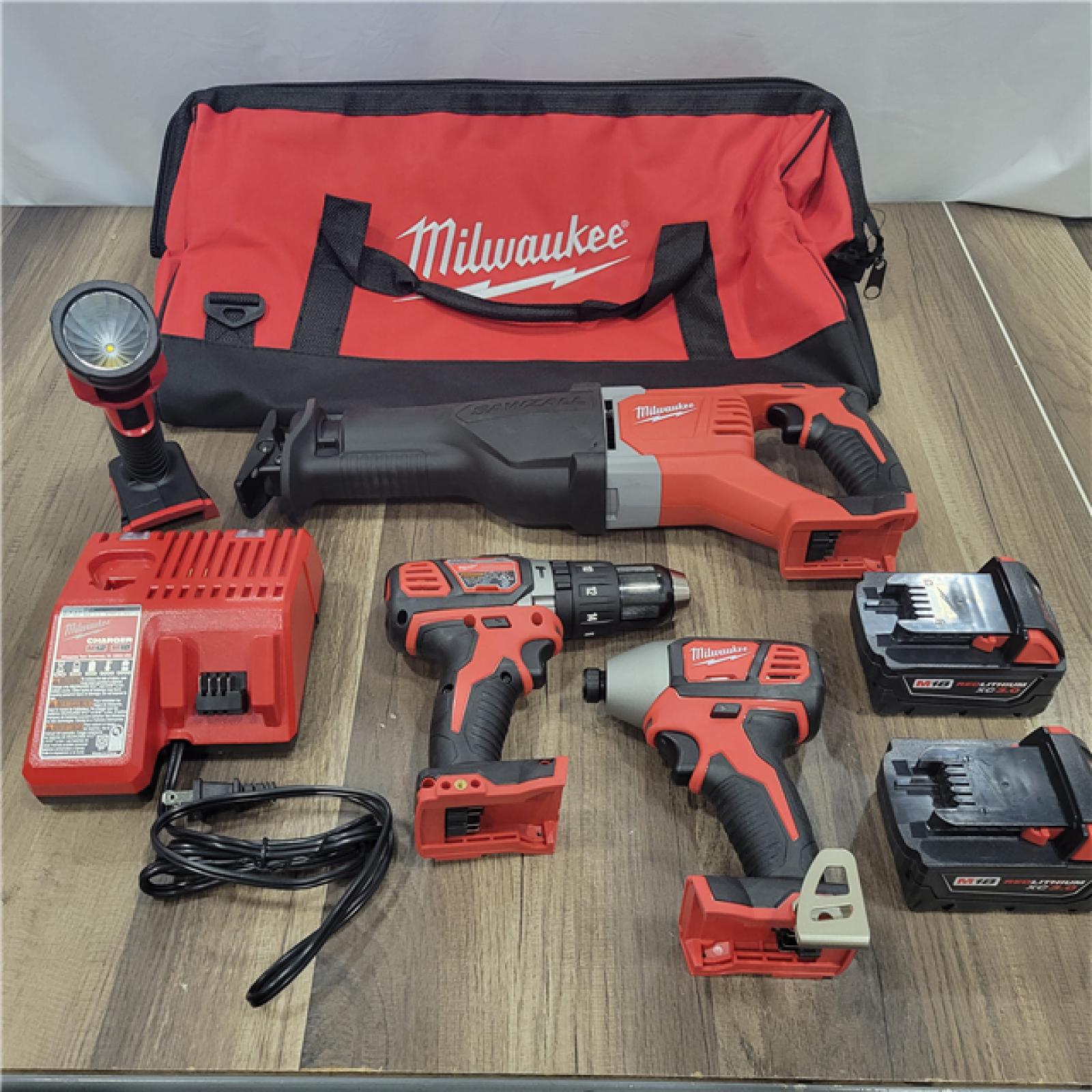 AS-IS MILWAUKEE M18 18V Lithium-Ion Cordless Combo Tool Kit with Two 3.0Ah Batteries, 1-Charger, 1-Tool Bag (4-Tool)