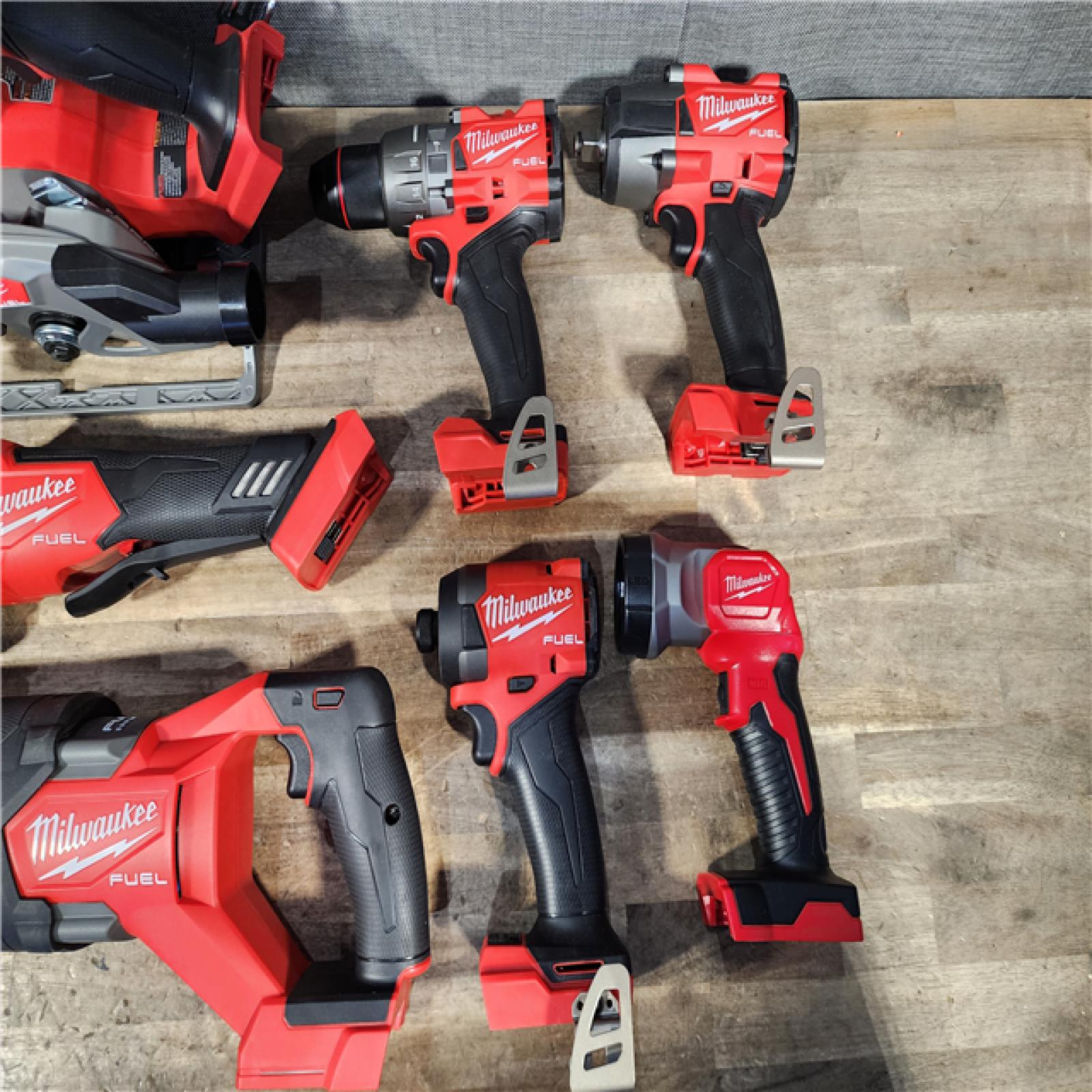 HOUSTON LOCATION - AS-IS Milwaukee M18 FUEL 18V Lithium-Ion Brushless Cordless Combo Kit with Two 5.0 Ah Batteries  1 Charger  2 Tool Bags (7-Tool)