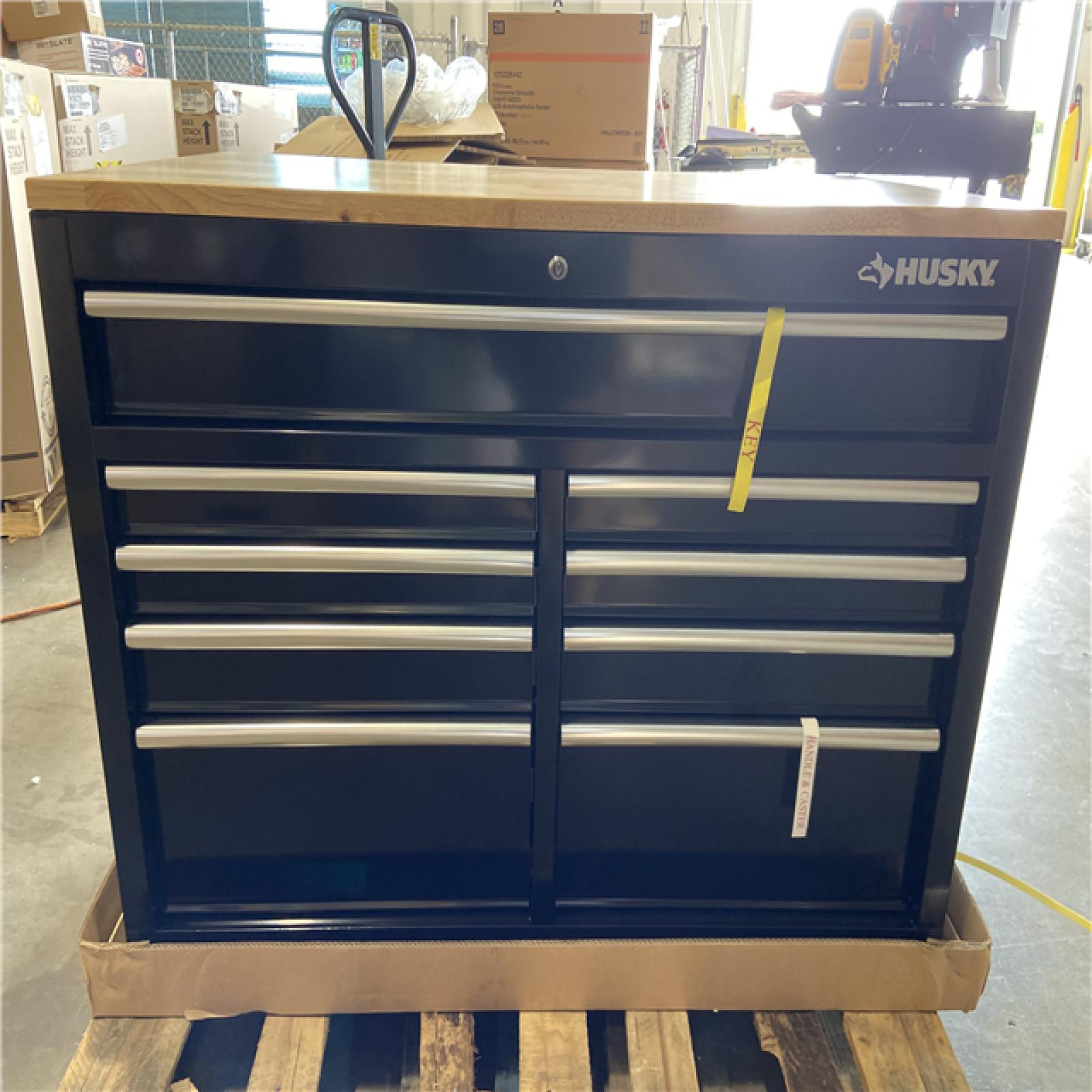 DALLAS LOCATION - Husky Tool Storage 46 in. W x 51 in. D Standard Duty Black Mobile Workbench Cabinet with Solid Top Full Length Extension Table