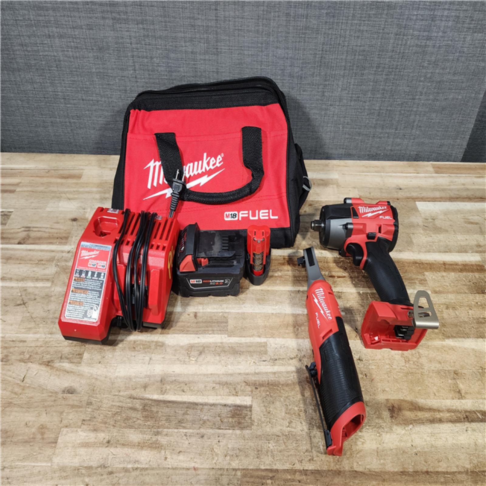 HOUSTON LOCATION - AS - IS Milwaukee FUEL 18V Cordless Mid Torque 1/2 in. Impact Wrench w/ 12 FUEL 3/8 in. Ratchet Combo Kit