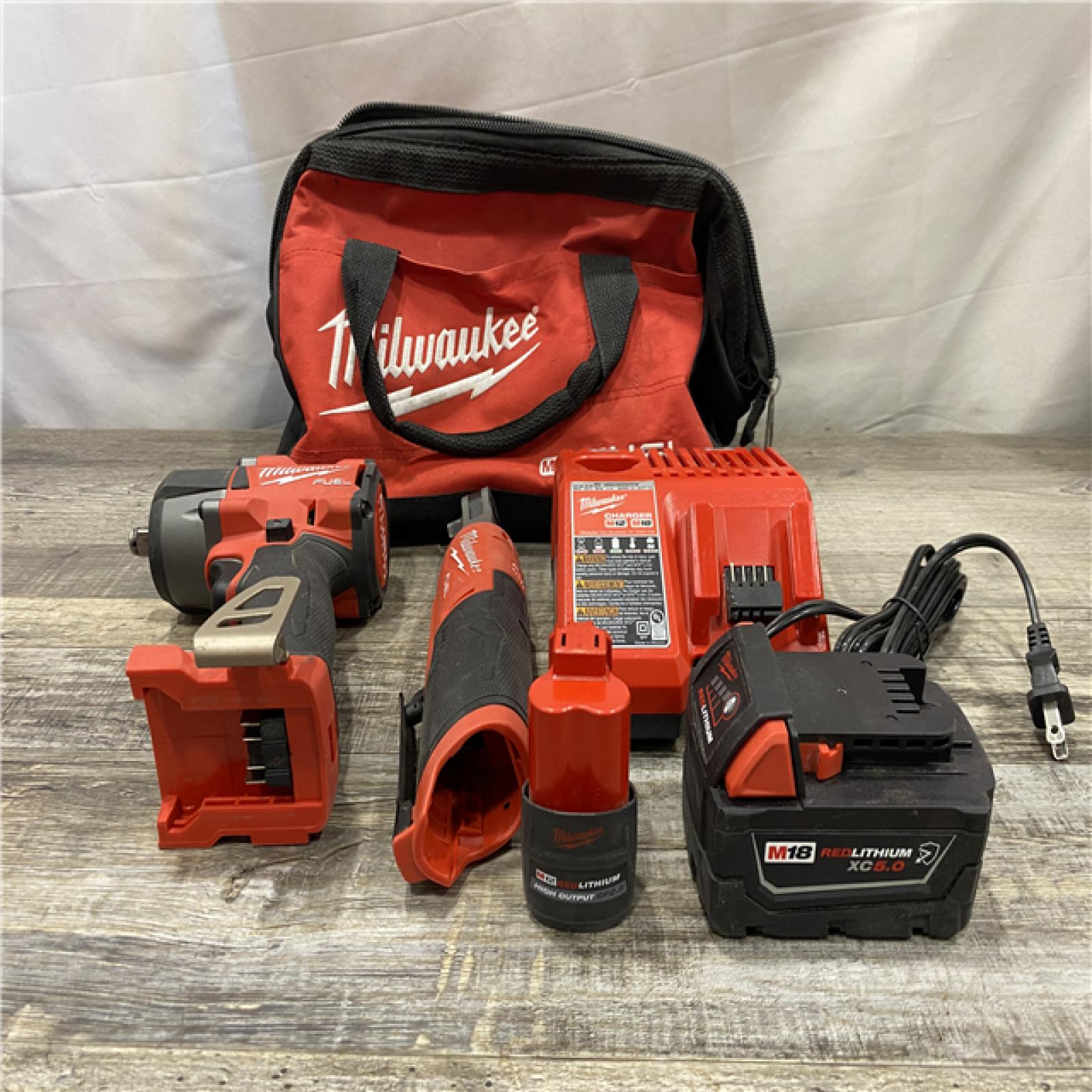 AS-IS Milwaukee FUEL 18V Cordless Mid Torque 1/2 in. Impact Wrench w/ M12 FUEL 3/8 in. Ratchet & Battery/Charger Combo Kit