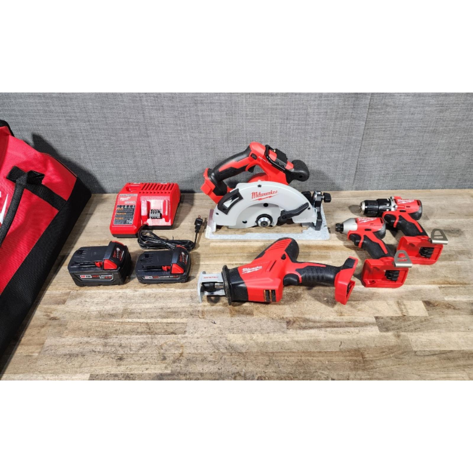 HOUSTON LOCATION - AS-IS Milwaukee M18 18-Volt Lithium-Ion Brushless Cordless Combo Kit (4-Tool) with 2-Batteries  1-Charger and Tool Bag