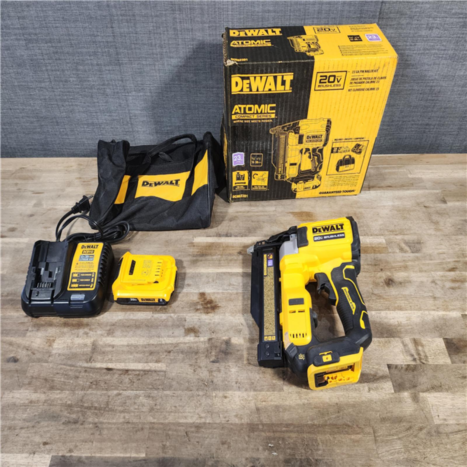HOUSTON LOCATION - AS-IS DEWALT ATOMIC 20V MAX Lithium Ion Cordless 23 Gauge Pin Nailer Kit with 2.0Ah Battery and Charger