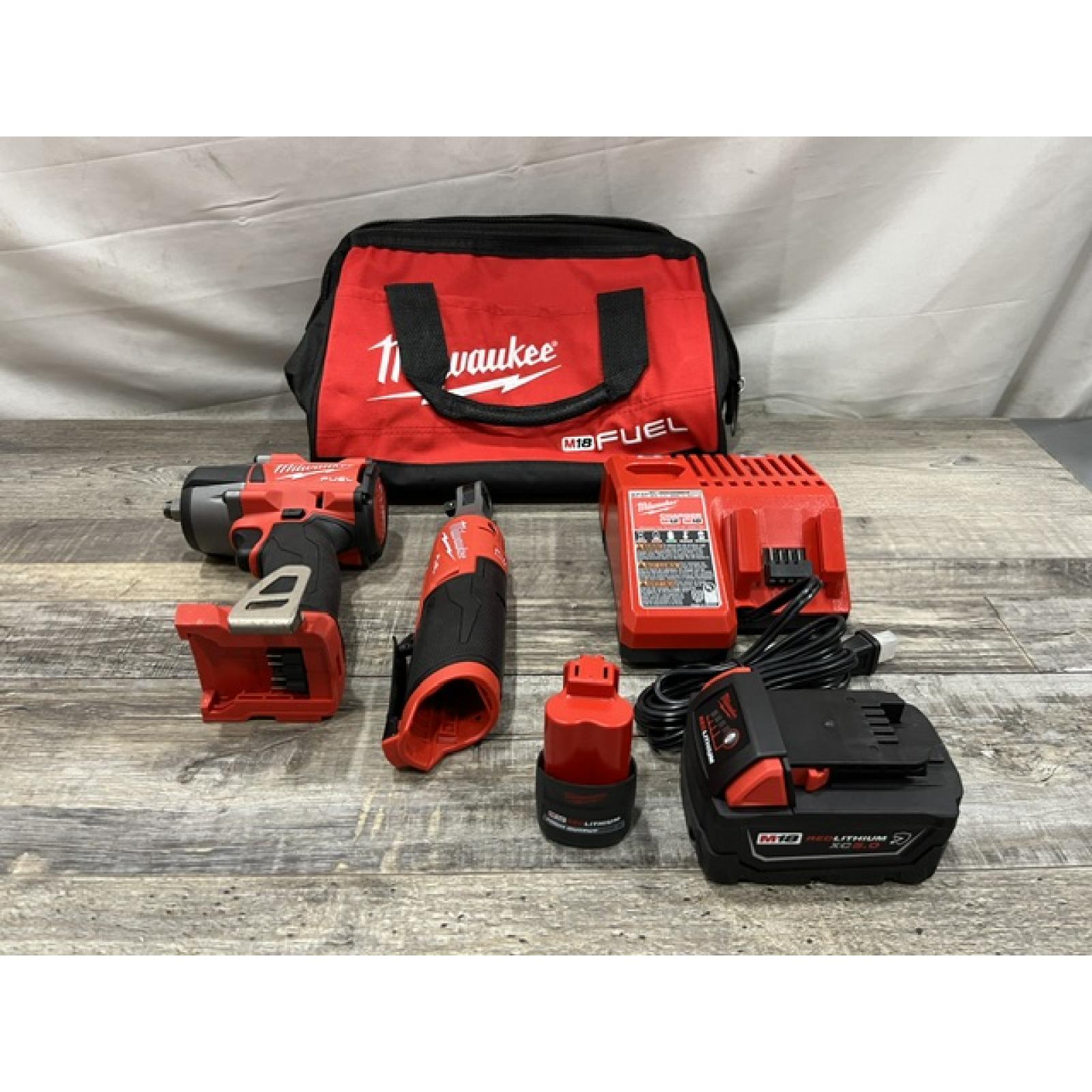 AS-IS Milwaukee FUEL 18V Cordless Mid Torque 1/2 in. Impact Wrench w/ 12 FUEL 3/8 in. Ratchet Combo Kit