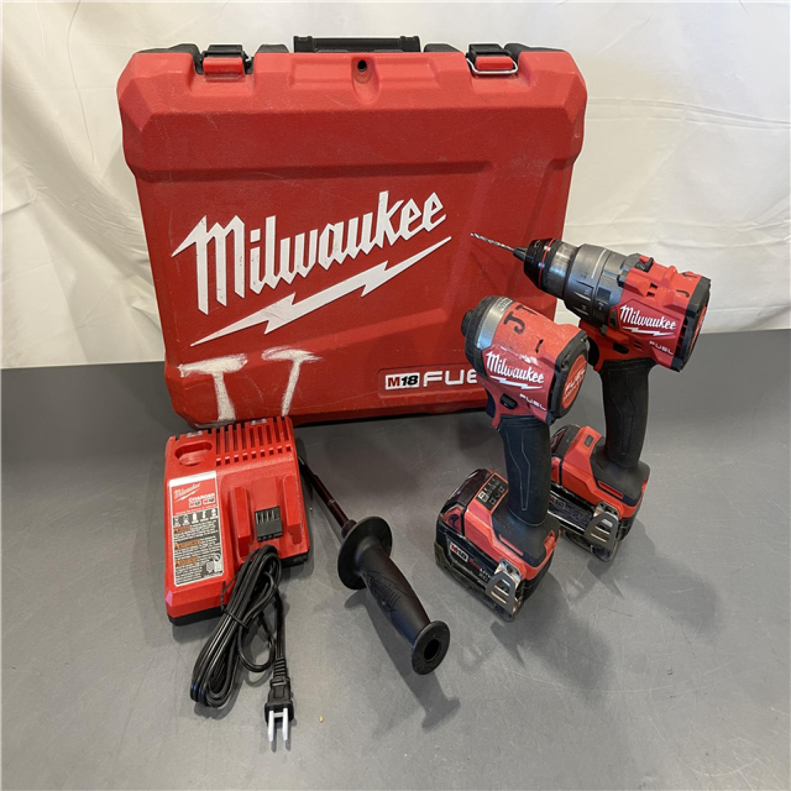 AS-IS - MILWAUKEE FUEL 18V Lithium-Ion Brushless Cordless Hammer Drill and Impact Driver Combo Kit (2-Tool) with 2 Batteries