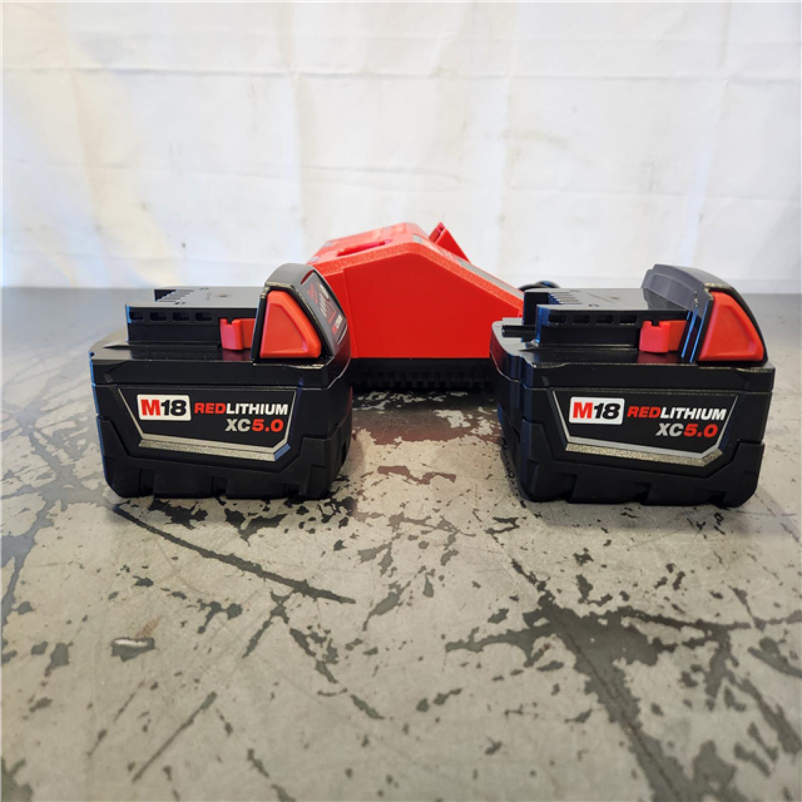 AS-IS- Milwaukee 18-Volt Lithium-Ion XC Starter Kit with Two 5.0Ah Batteries and Charger