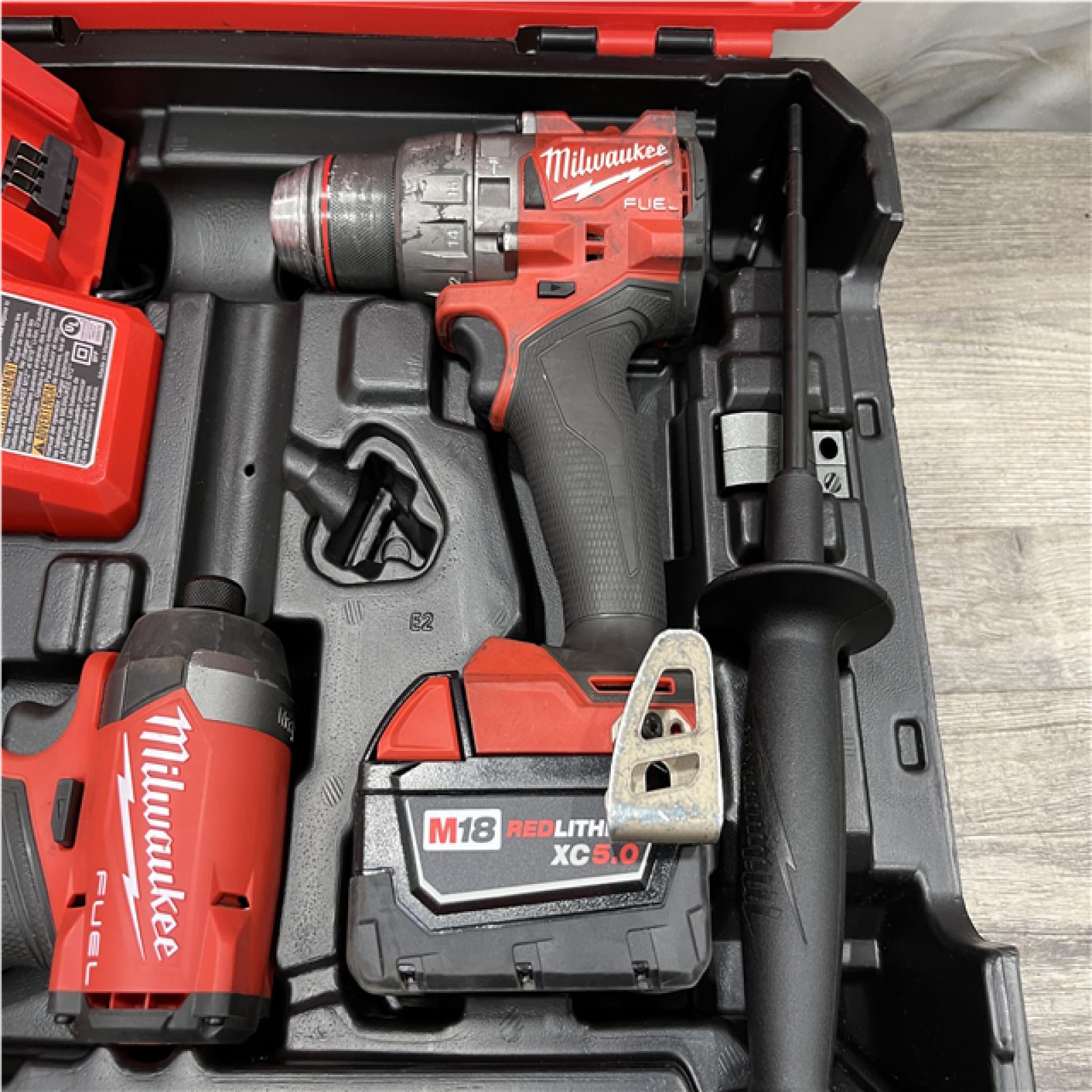 AS-IS Milwaukee FUEL 18V Lithium-Ion Brushless Cordless Hammer Drill and Impact Driver Combo Kit