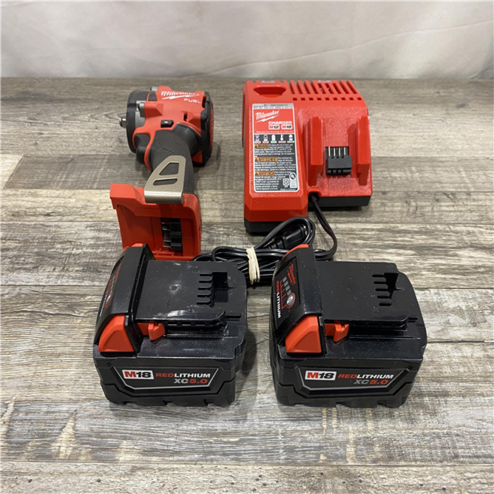 AS-IS Milwaukee FUEL 18V Lithium-Ion Brushless Cordless 3/8 in. Compact Impact Wrench Kit