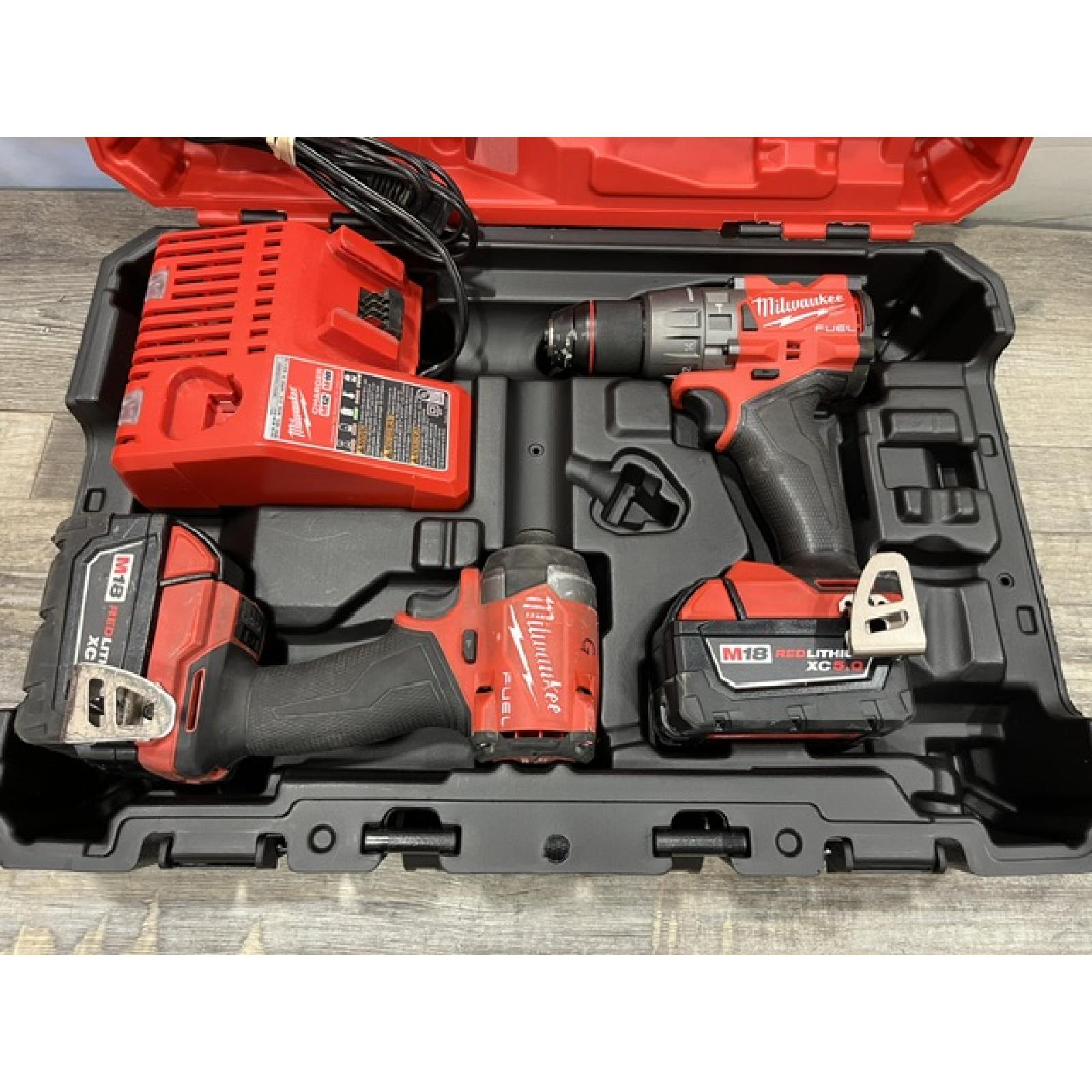 AS-IS Milwaukee FUEL 18V Lithium-Ion Brushless Cordless Hammer Drill and Impact Driver Combo Kit
