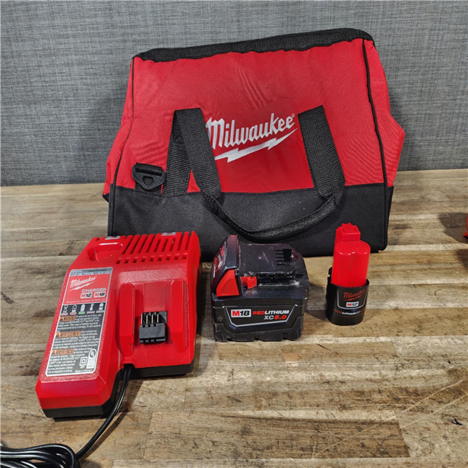 HOUSTON LOCATION - AS-IS Milwaukee 12/18V Lithium-Ion Cordless 3/8 in. Ratchet and 1/2 in. High Torque Impact Wrench with Friction Ring Combo Kit