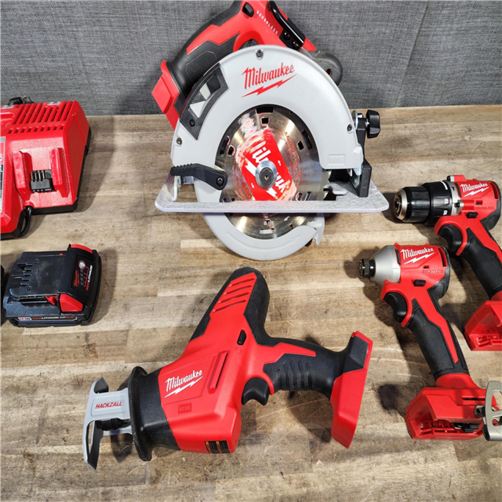 HOUSTON LOCATION - AS-IS Milwaukee M18 18-Volt Lithium-Ion Brushless Cordless Combo Kit (4-Tool) with 2-Batteries  1-Charger and Tool Bag
