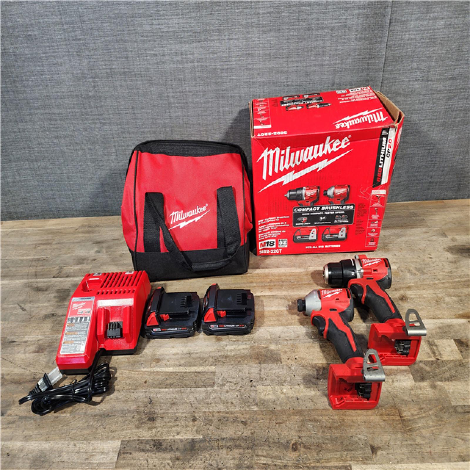 HOUSTON LOCATION - AS-IS Milwaukee M18 18V Lithium-Ion Brushless Cordless Compact Drill/Impact Combo Kit (2-Tool) W/(2) 2.0 Ah Batteries  Charger & Bag
