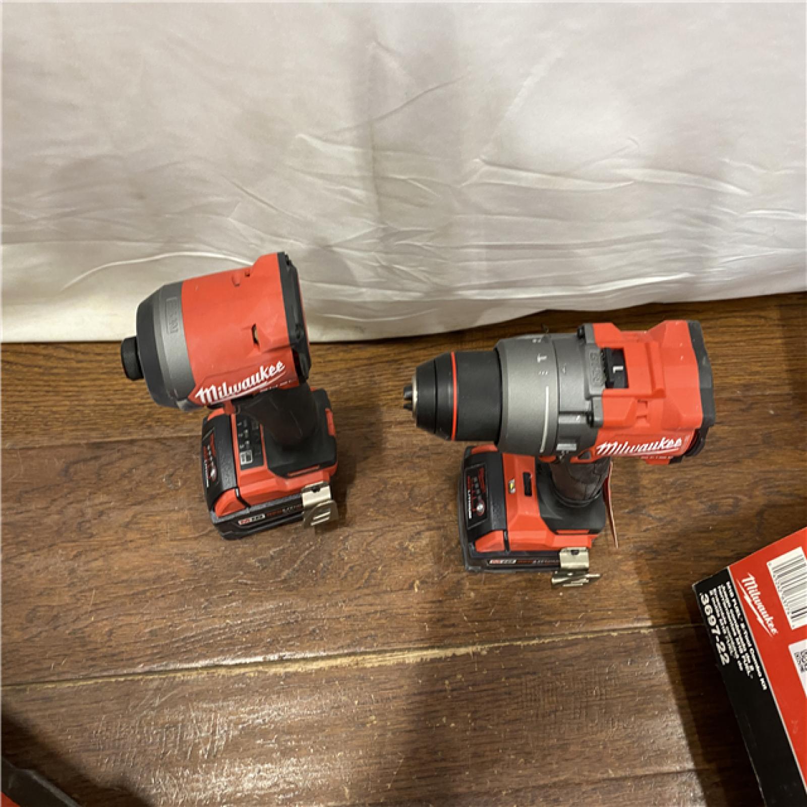 AS-IS MILWAUKEE M18 FUEL 18V Lithium-Ion Brushless Cordless Hammer Drill and Impact Driver Combo Kit (2-Tool) with 2 Batteries