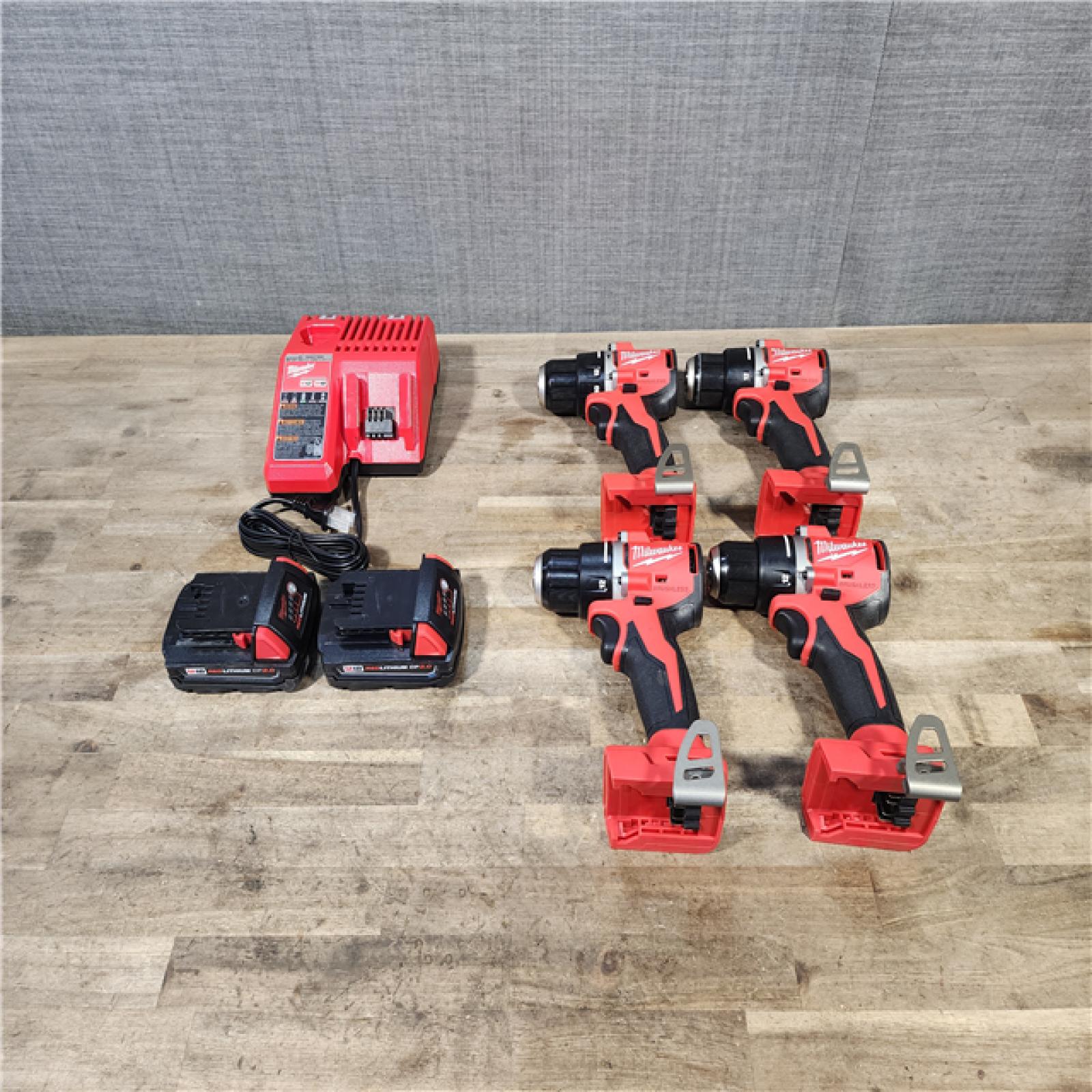 HOUSTON LOCATION - AS-IS MILWAUKEE 4 TOOL COMBO KIT W/ (2) BATTERY & CHARGER