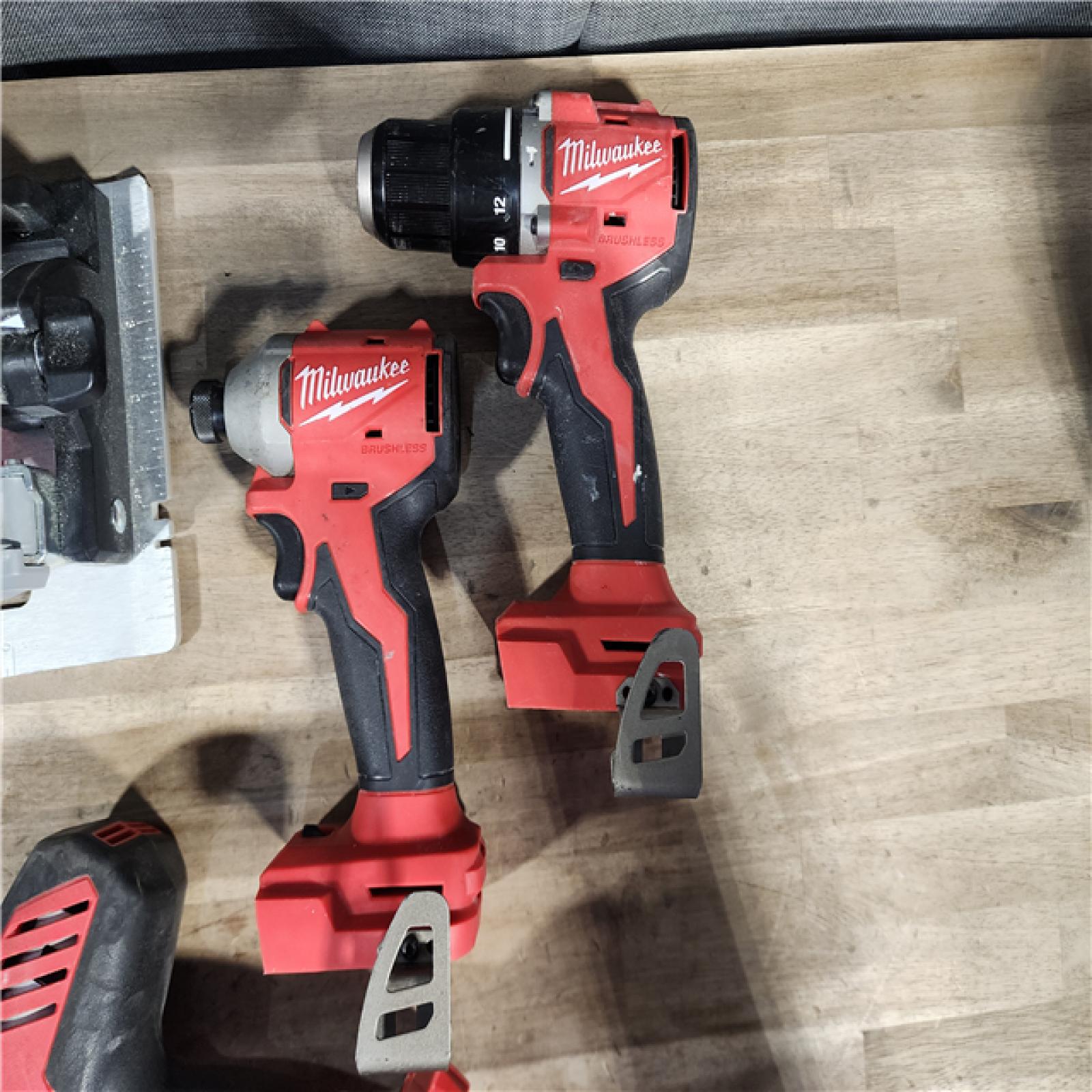 HOUSTON LOCATION - AS-IS Milwaukee M18 18-Volt Lithium-Ion Brushless Cordless Combo Kit (4-Tool) with 2-Batteries, 1-Charger and Tool Bag